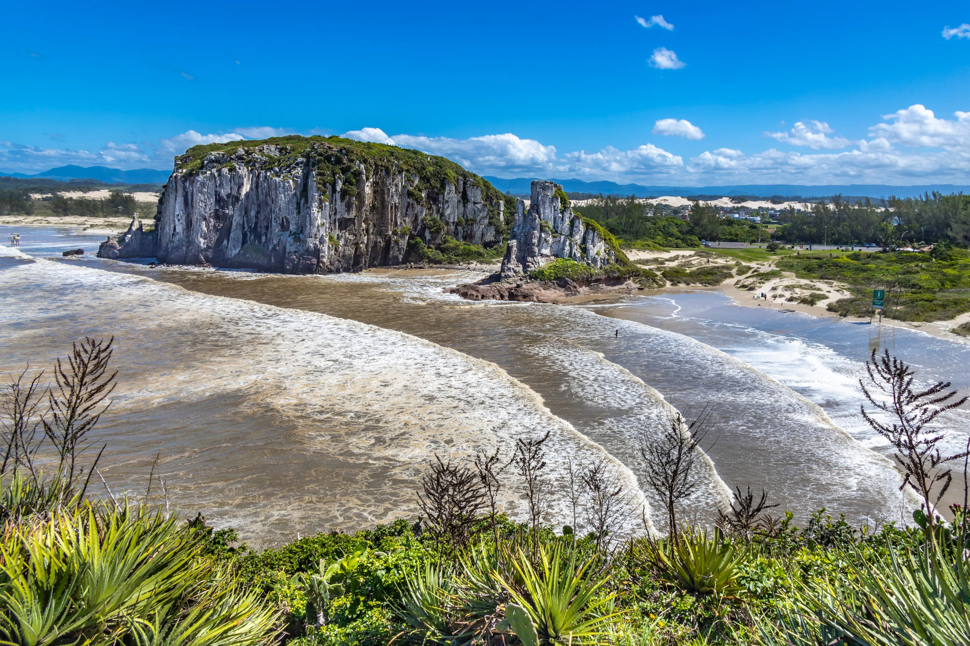 TORRES, BRAZIL - CIRCA MARCH, 2022: Praia da Guarita seen from Torre do Meio, a rock formation in Guarita Park, a tourist attraction in the city of Torres, in the state of Rio Grande do Sul