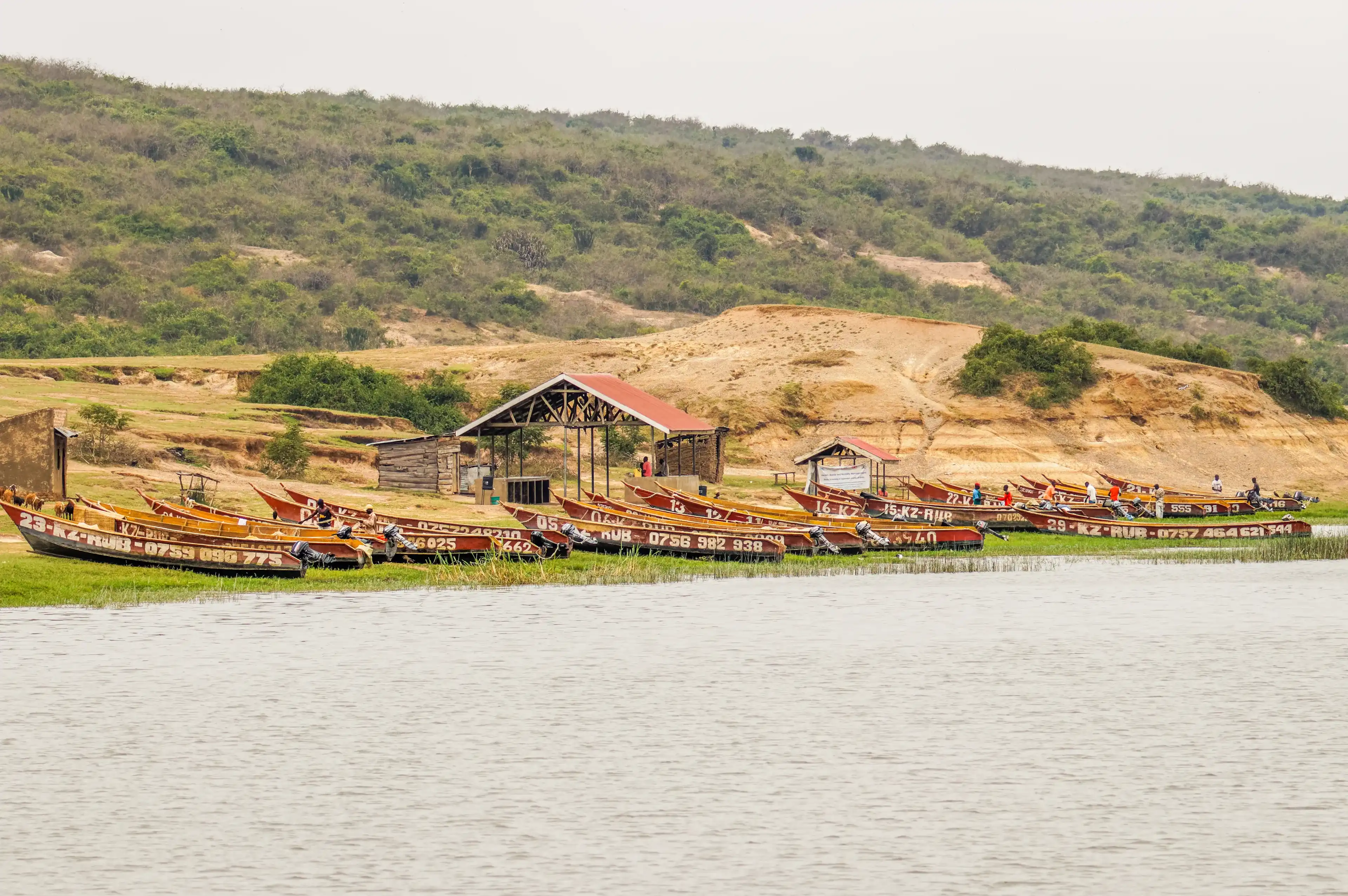 Kazinga Channel / Uganda - february 28 2020: Fishing boats shown on the Kazinga channel shore. The Kazinga channel is the only source of transportation in this region of central Africa.