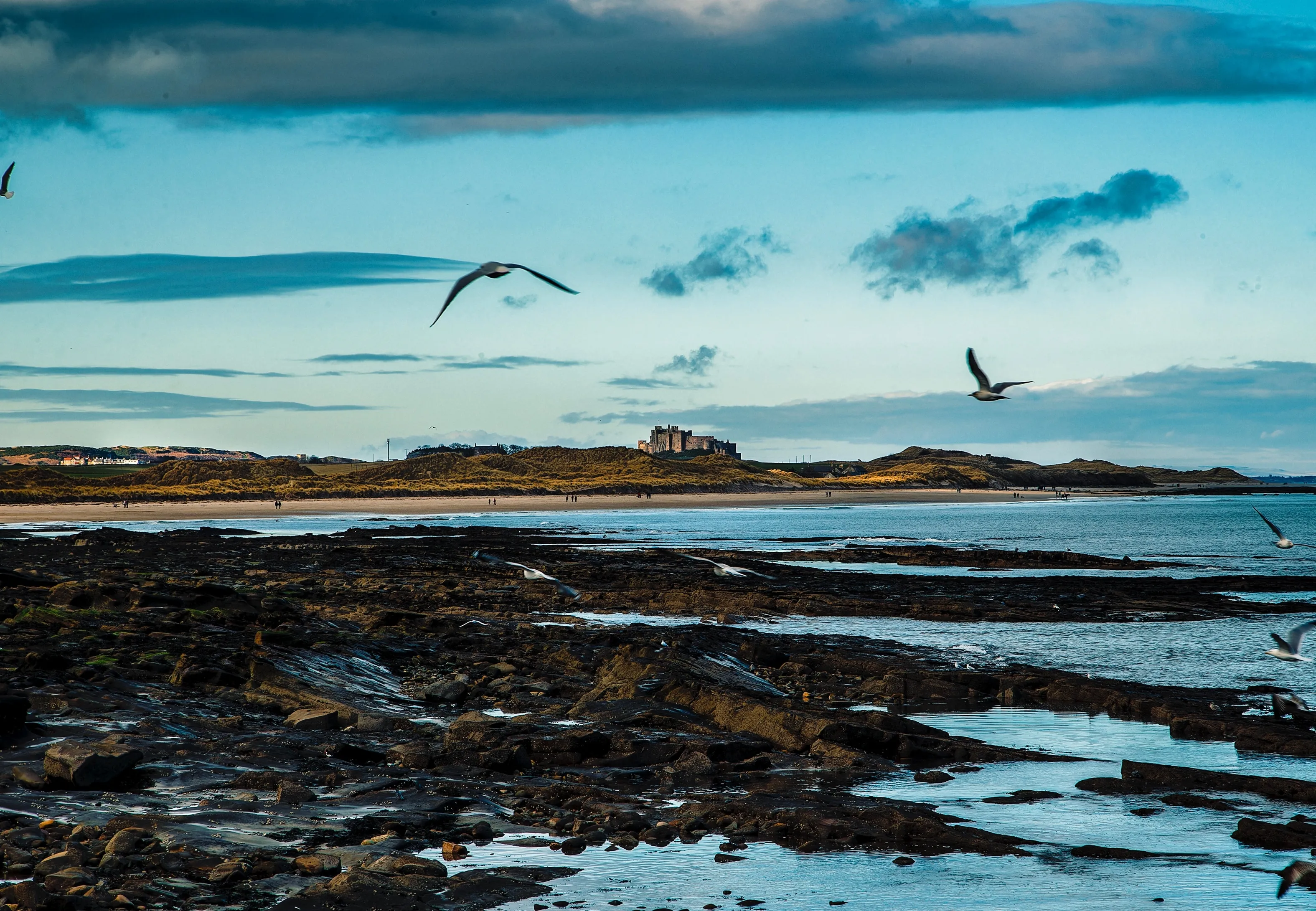 Seahouse, United Kingdom-January 20, 2018: Bamburgh Castle from the harbour at Aeahouses, in Northumberland, England.