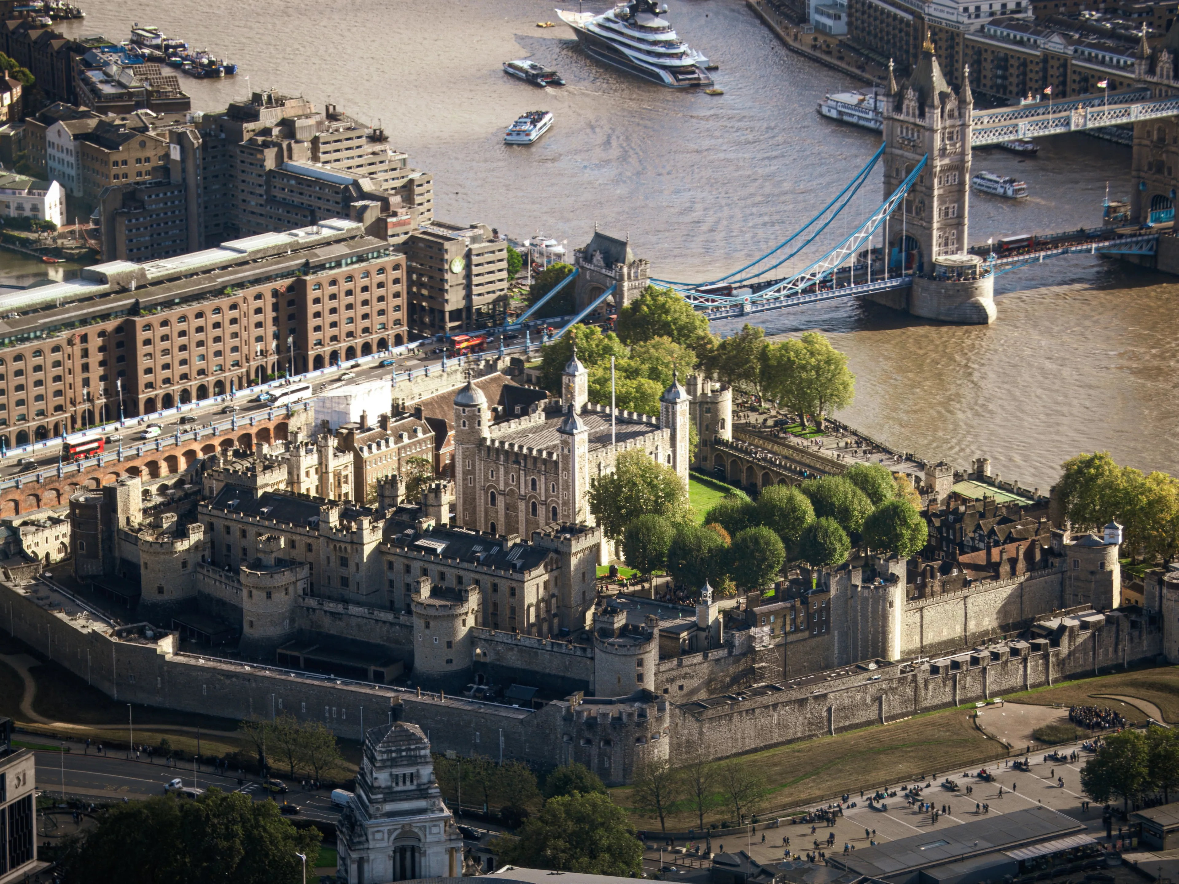Aerial photograph of the iconic Tower of London and Tower Bridge across the River Thames