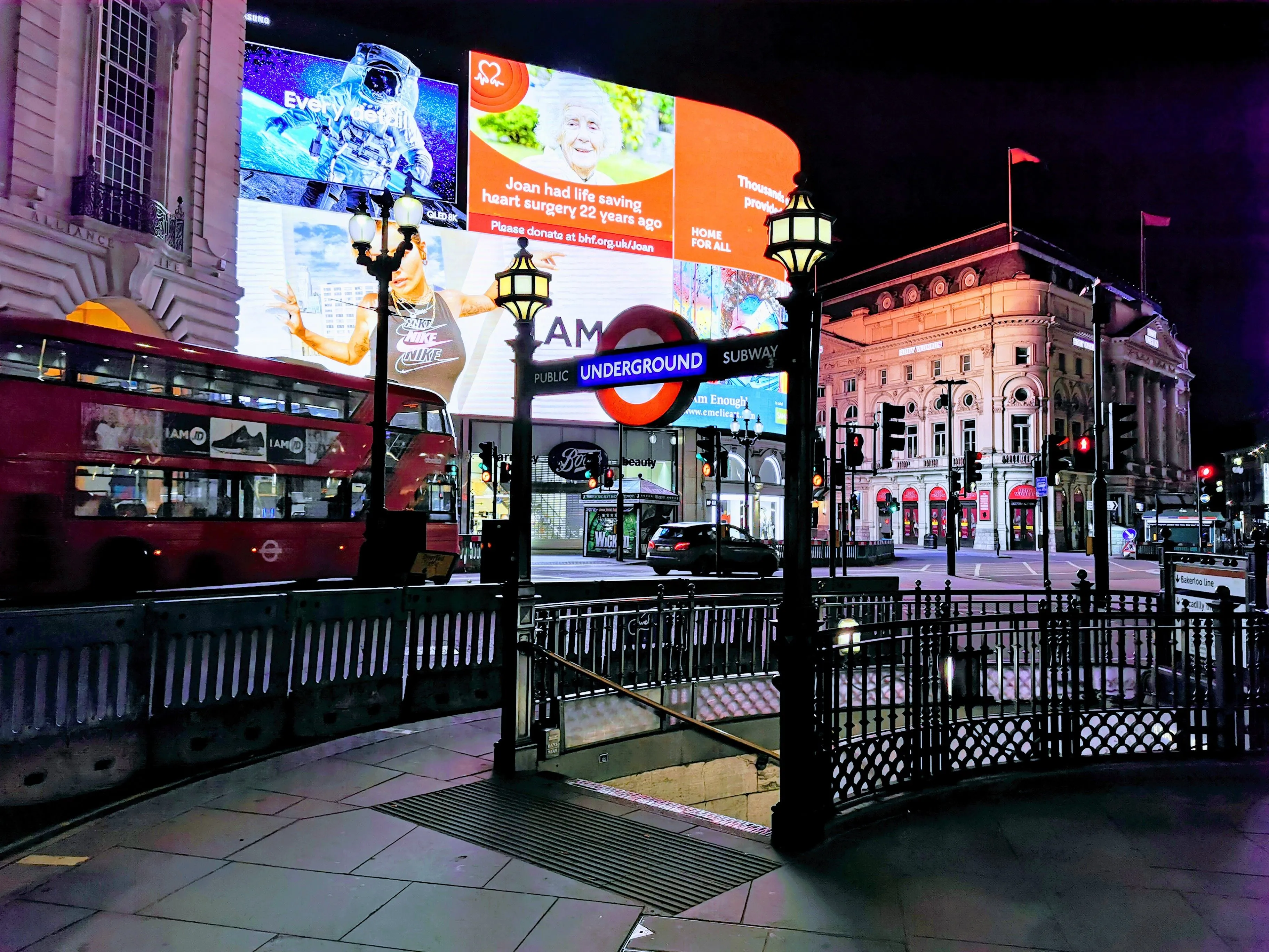 Vibrant night scene of Piccadilly Circus with iconic London landmarks and lights