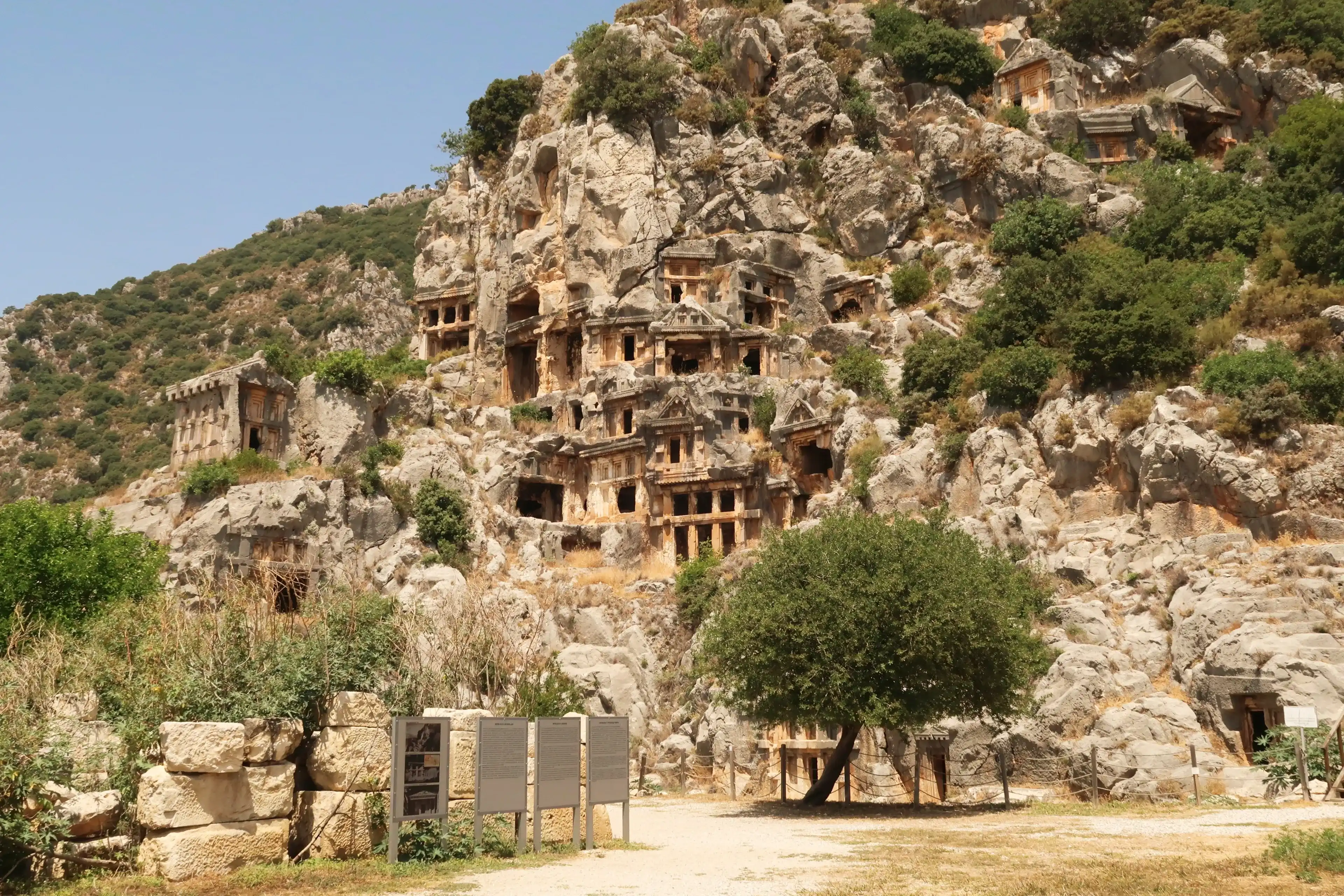 The archaeological site of Myra with its famous rock hewn, rock cut tombs on the cliff in the background, close to Demre, Turkey, 26th of May 2022 The archaeological site of Myra with its famous rock hewn, rock cut tombs on the cliff in the background, close to Demre, Turkey, 26th of May 2022
