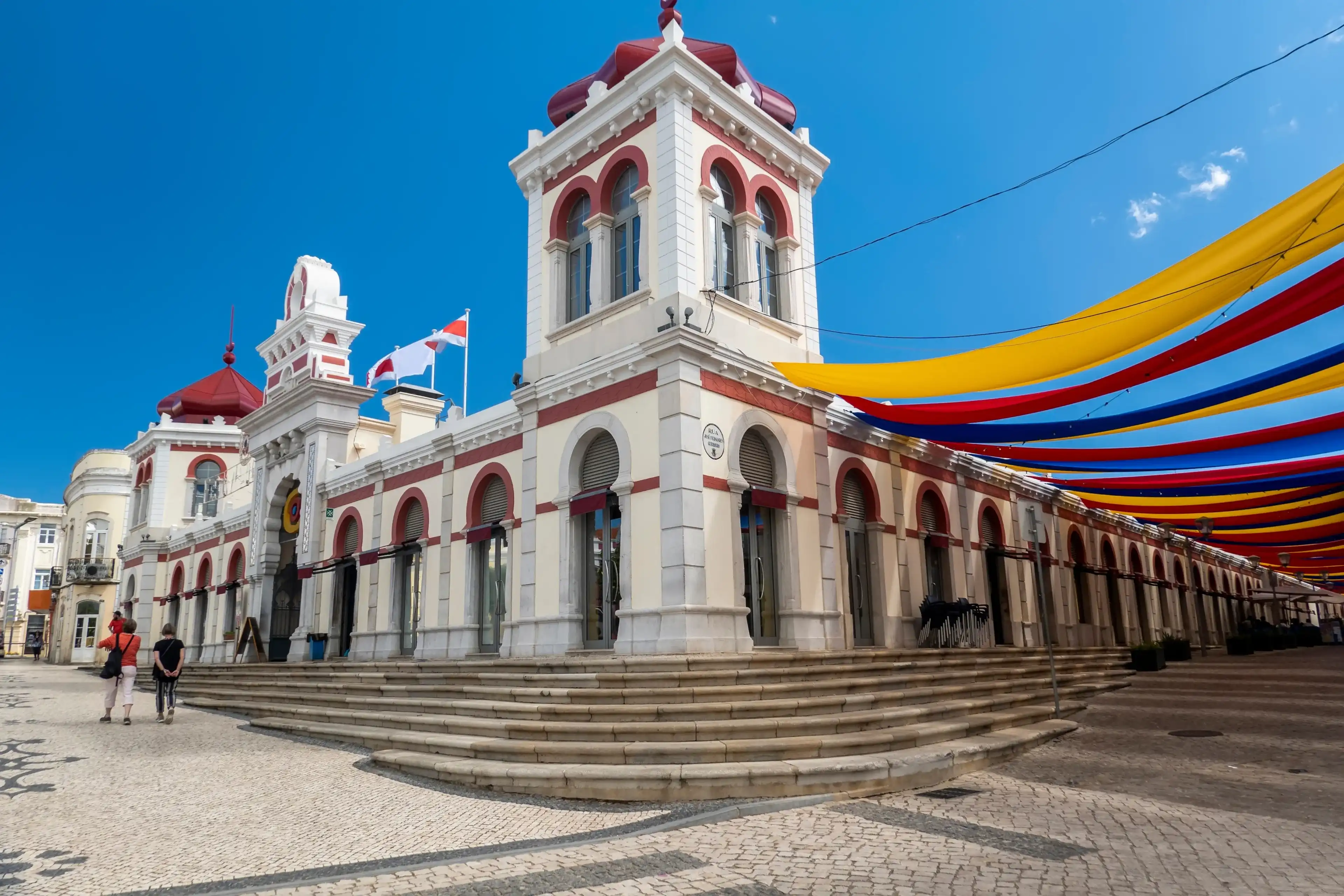 LOULE, PORTUGAL - 25th JUNE 2022: Protection cloth in the street for creating shade in the city of Loule, near the market, in the Algarve, Portugal. LOULE, PORTUGAL - 25th JUNE 2022: Protection cloth in the street for creating shade in the city of Loule, near the market, in the Algarve, Portugal.