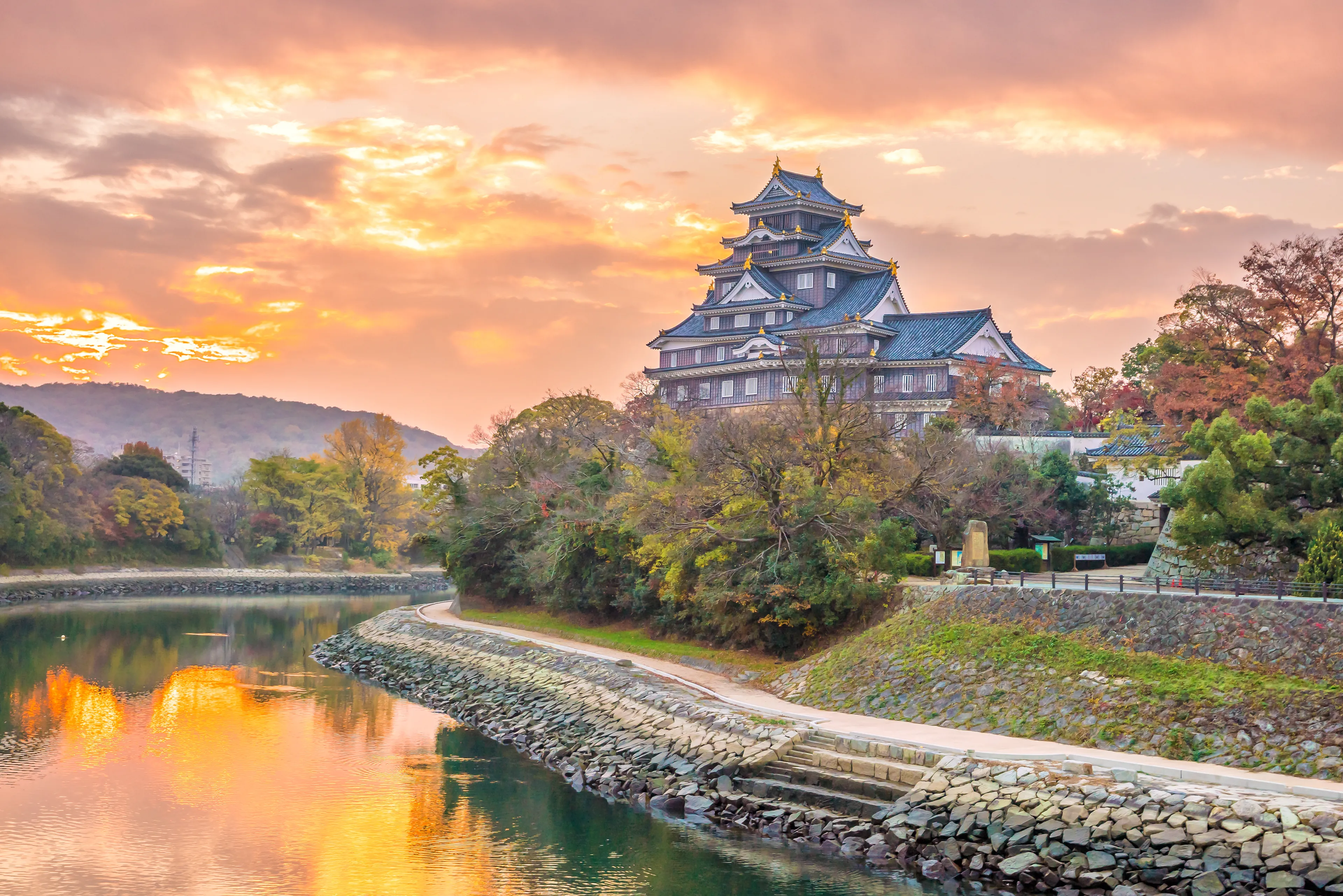 Okayama castle in autumn season in Okayama city, Japan at sunset