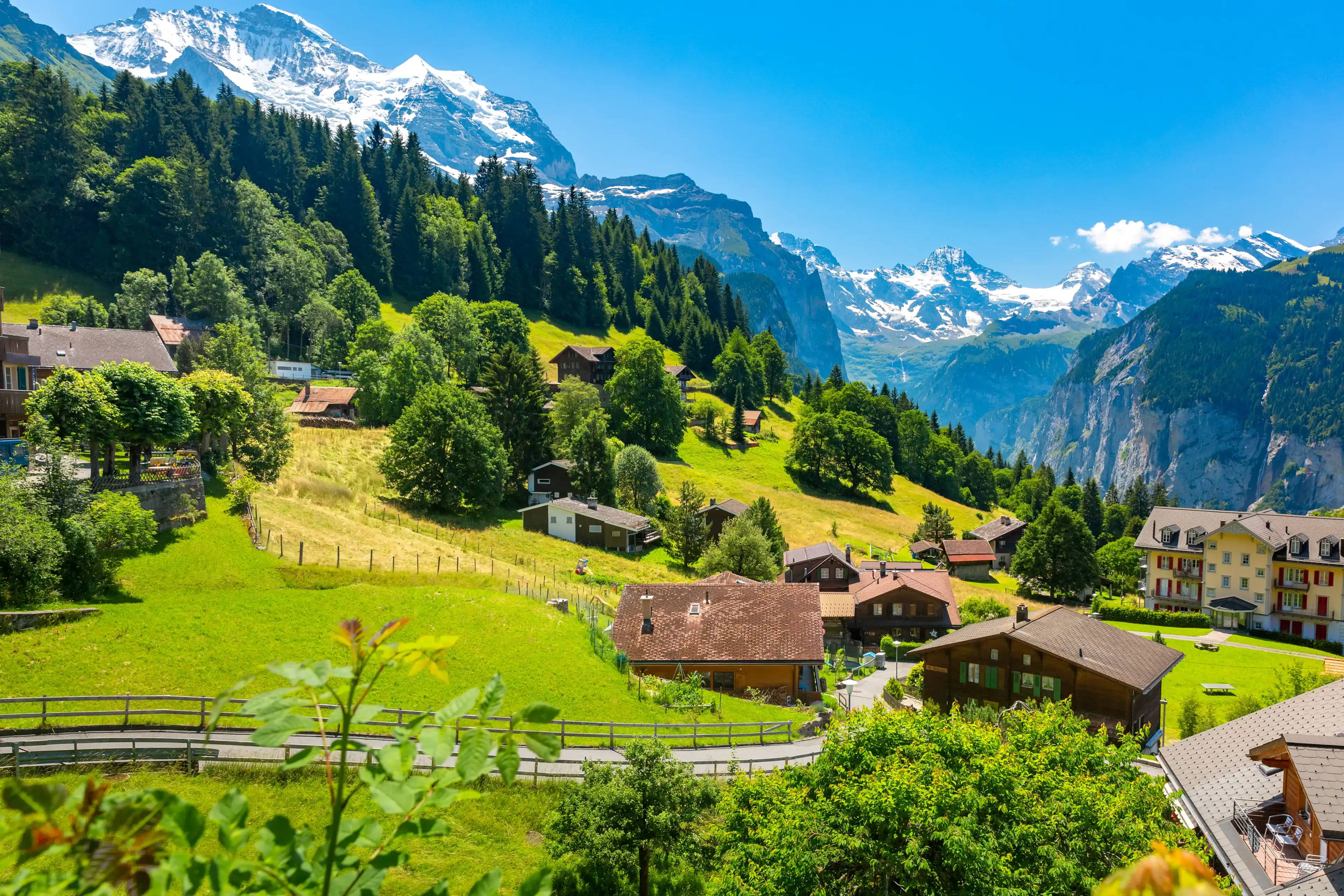 Wonderful mountain car-free village Wengen, Bernese Oberland, Switzerland. The Jungfrau is visible in the background Wonderful mountain car-free village Wengen, Bernese Oberland, Switzerland. The Jungfrau is visible in the background
