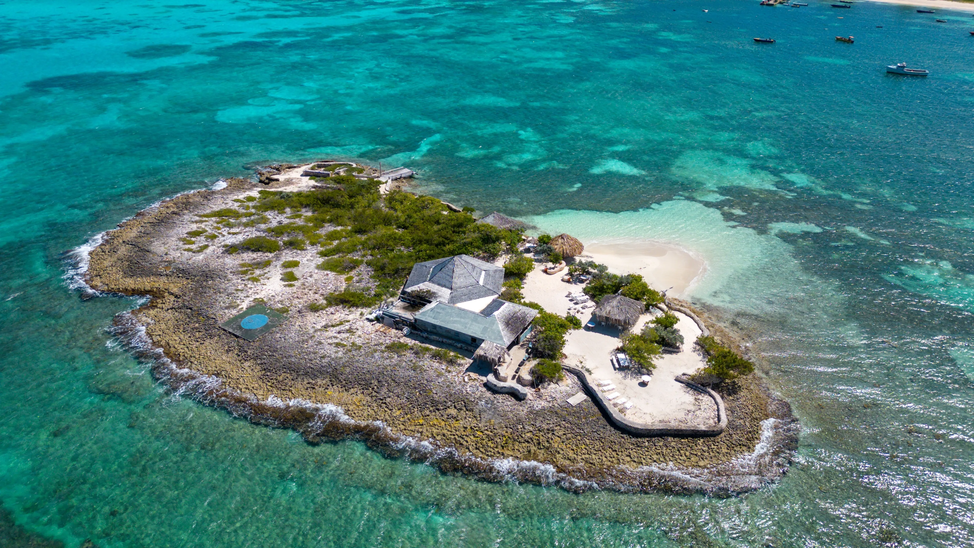 Scilly Cay, Island Harbor, Anguilla. Drone shot on a beautiful sunny day in the Caribbean. Turquoise blue sea with crystal clear and calm waters. Beautiful corals for snorkelling.