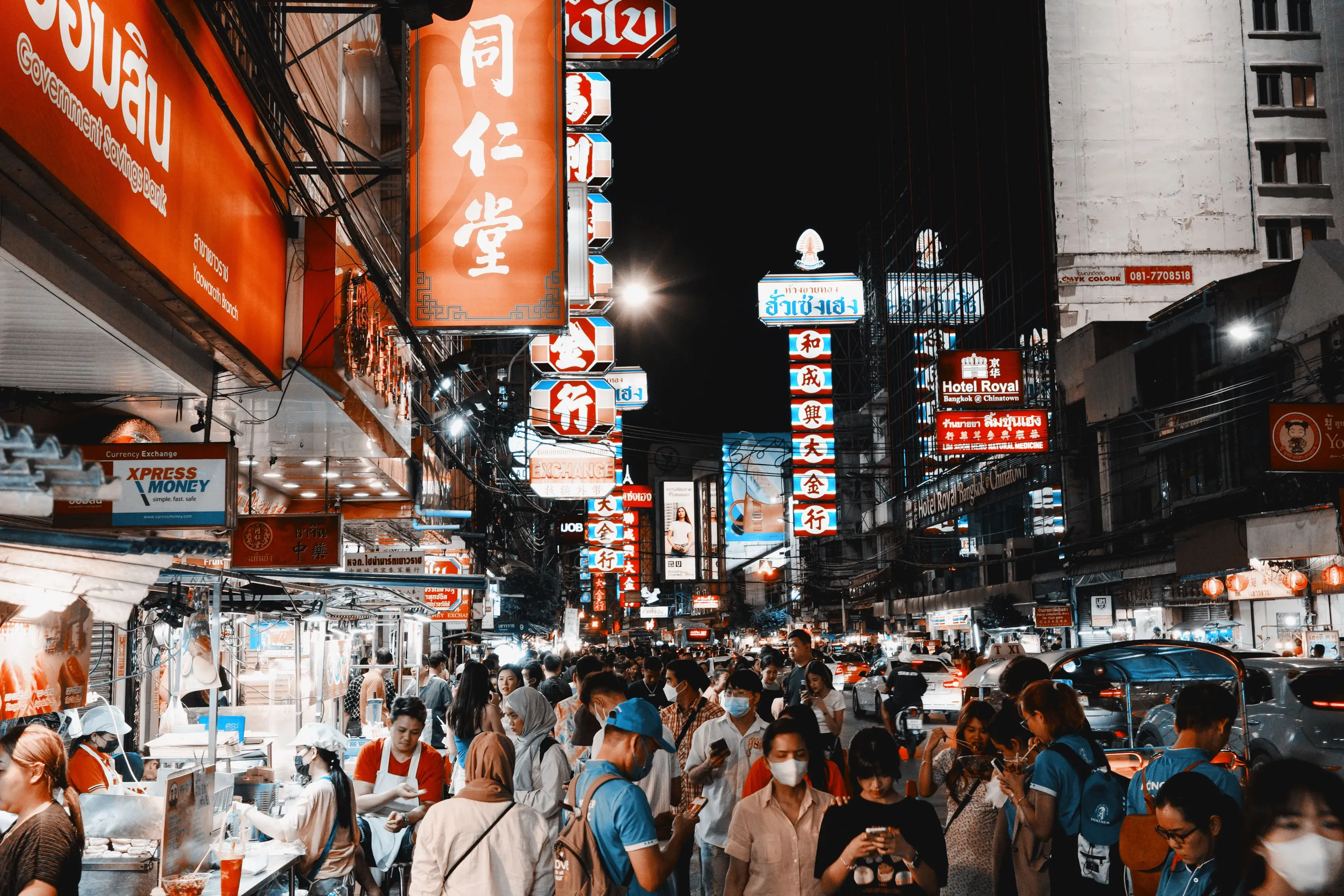 Vibrant night life on a busy street in Bangkok's Chinatown filled with lights and crowds Vibrant night life on a busy street in Bangkok's Chinatown filled with lights and crowds