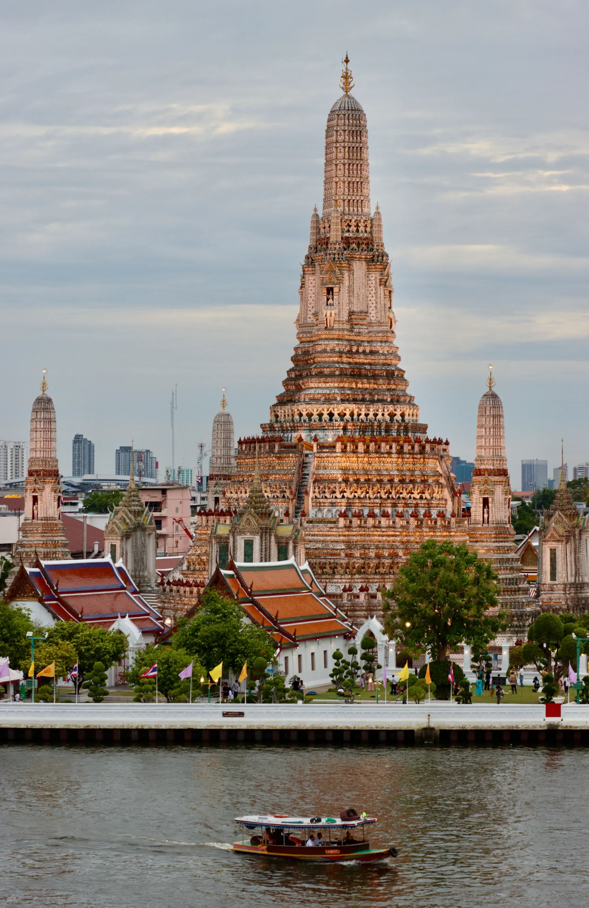 A stunning view of Wat Arun temple with a river foreground in Bangkok, Thailand A stunning view of Wat Arun temple with a river foreground in Bangkok, Thailand