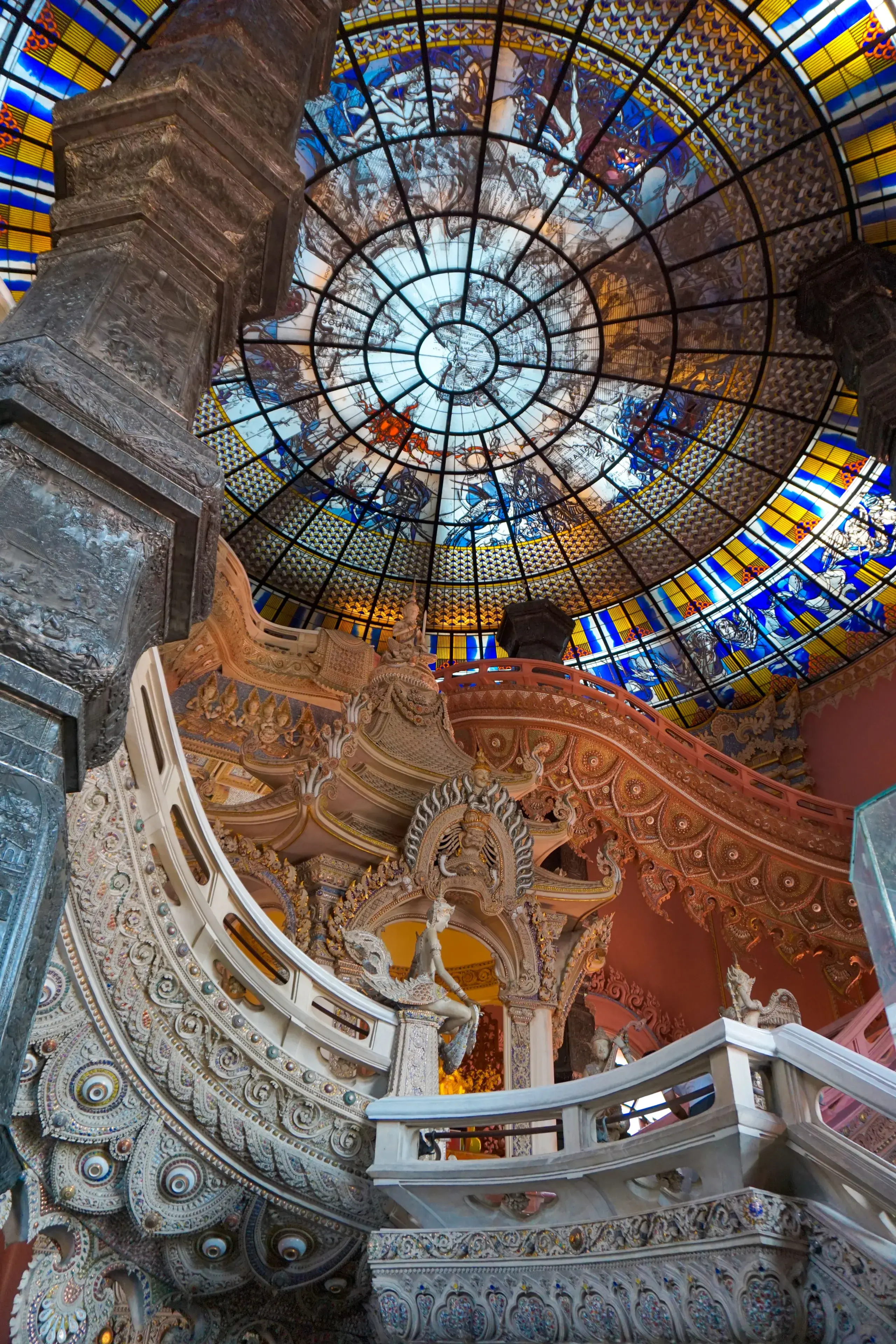 A stunning stained glass dome with ornate details in a historical building interior A stunning stained glass dome with ornate details in a historical building interior
