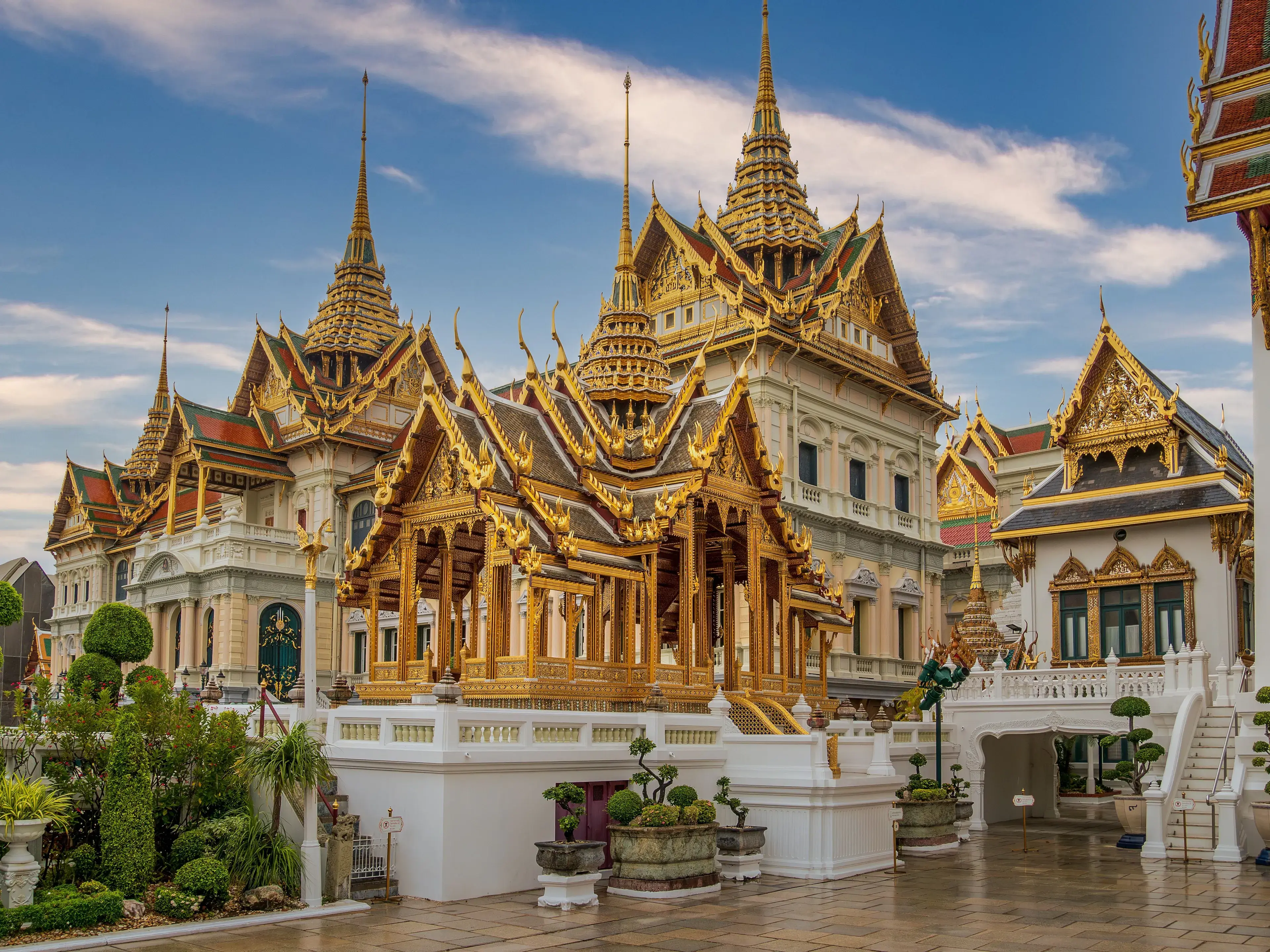 Captivating view of ornate golden temples at Bangkok's Grand Palace, Thailand. Captivating view of ornate golden temples at Bangkok's Grand Palace, Thailand.