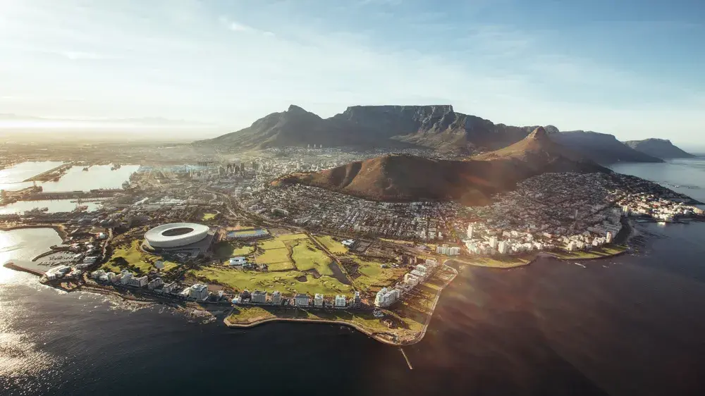 Aerial view of Cape Town with Cape Town Stadium, Lion's Head and Table mountain. Aerial view of Cape Town with Cape Town Stadium, Lion's Head and Table mountain.