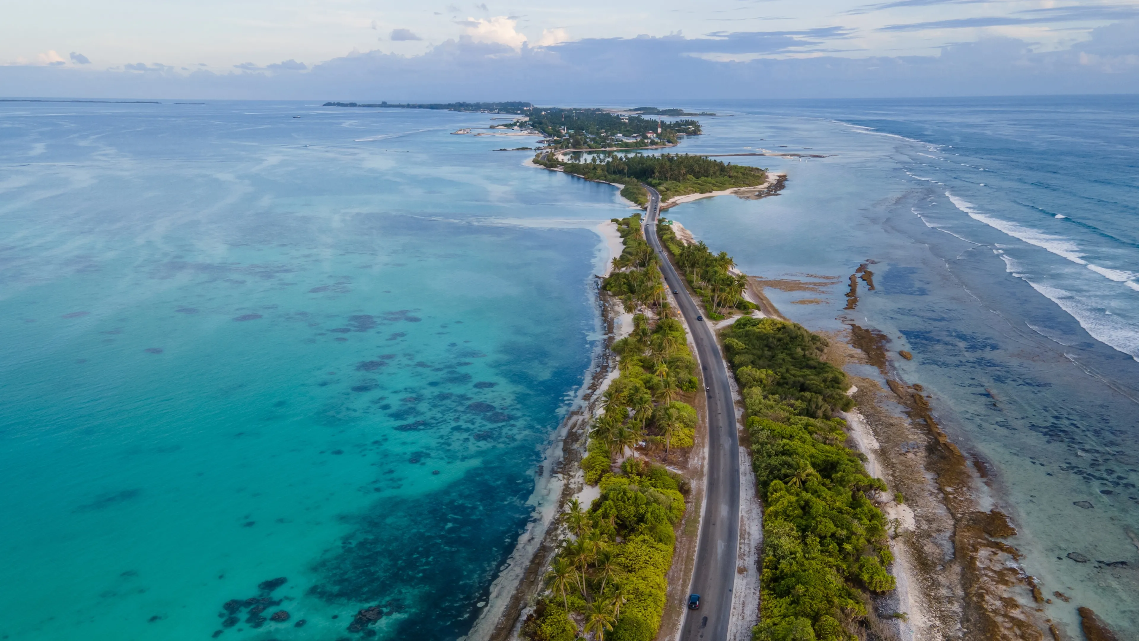 Aerial view of tropical beach landscape and local road at addu city, the southernmost atoll of Maldives in Indian ocean. Maldives tourism and summer vacation concepts