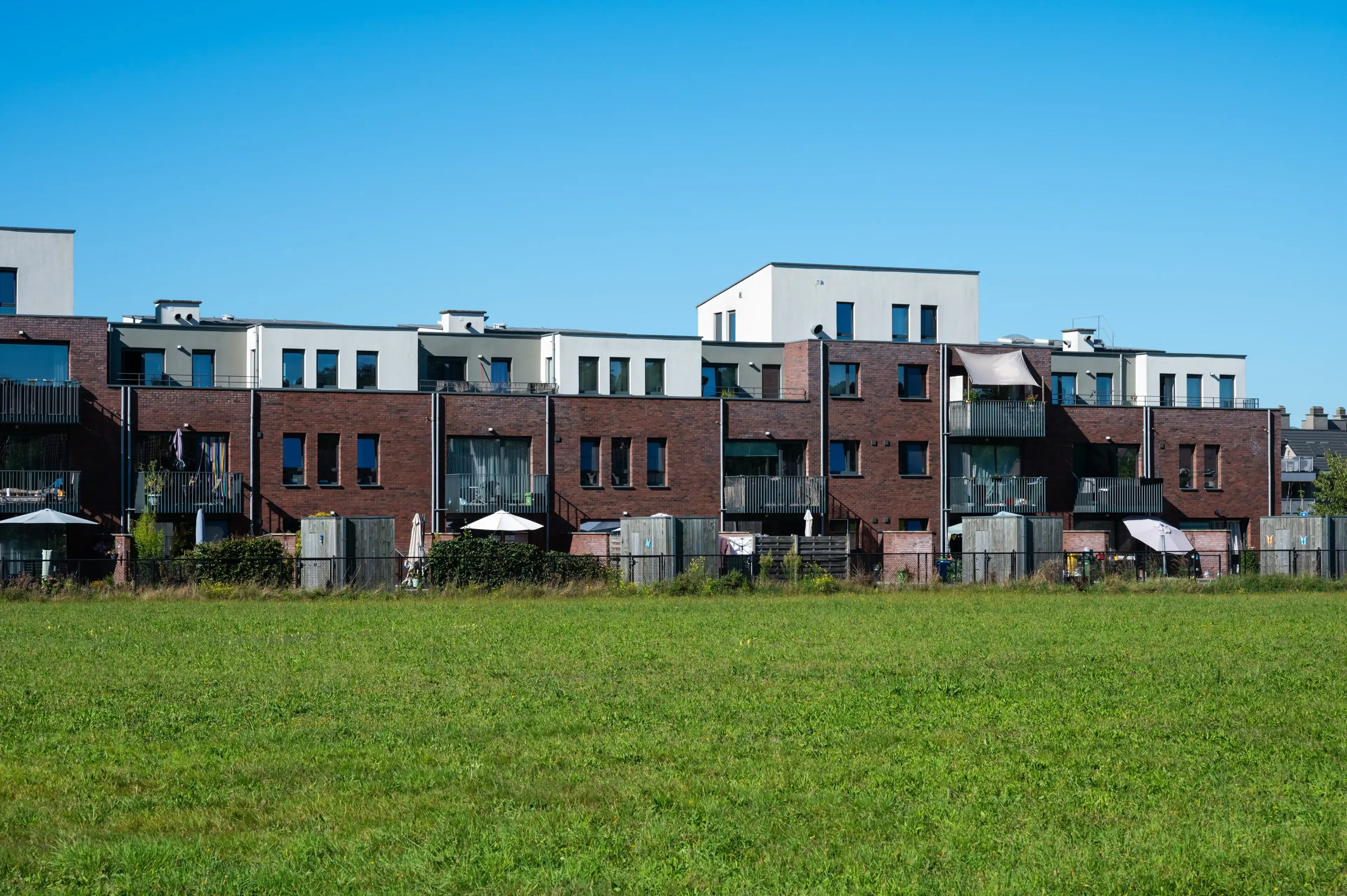 Essen, Antwerp Province, Belgium, September 9, 2023 - Contemporary apartment blocks with green surroundings