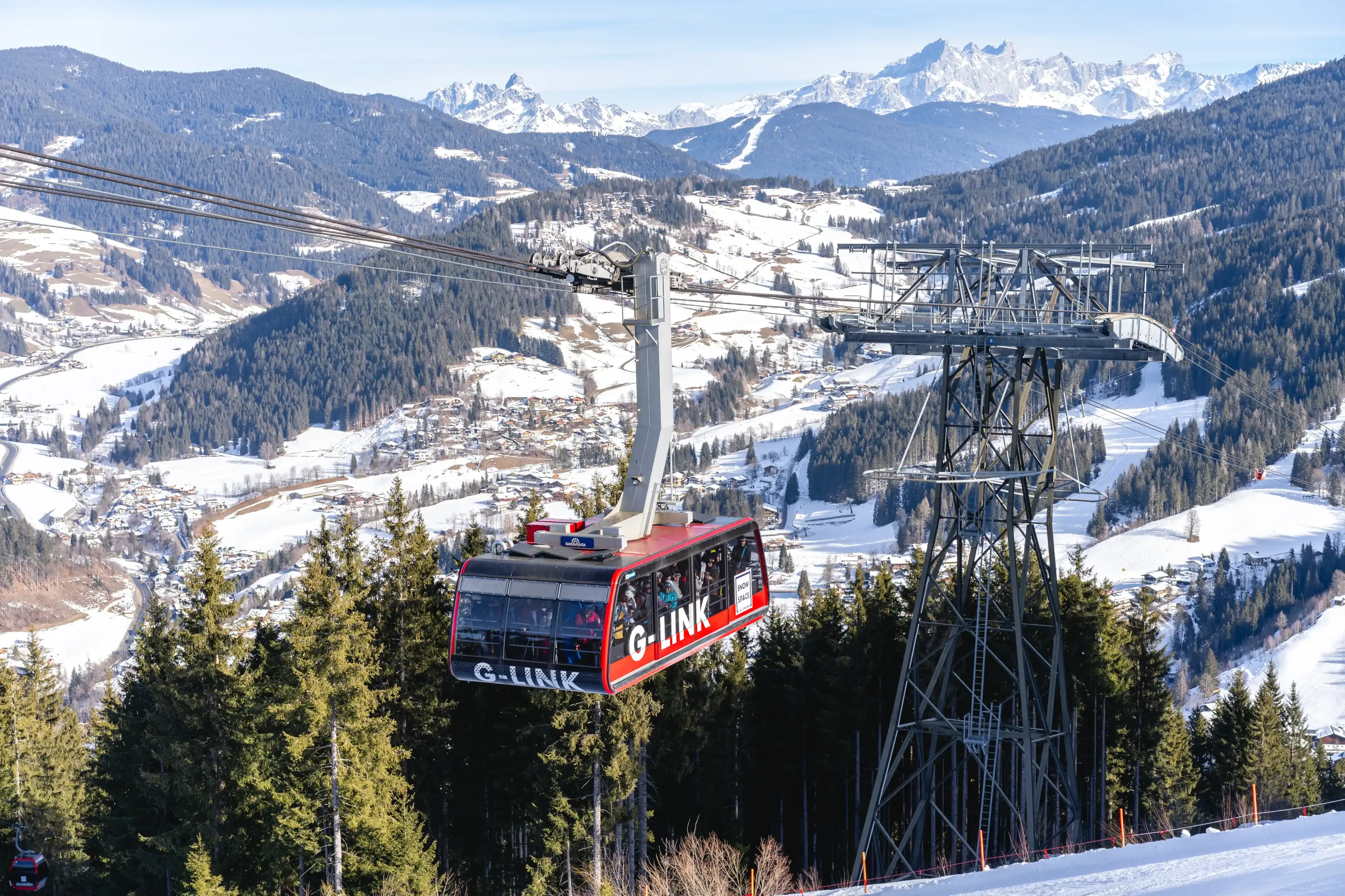 Wagrain, Austria - January 22, 2025: G-link aerial tramway transporting skiers between Wagrain and Flachau ski resorts, with capacity of 130 skiers in a cabin Wagrain, Austria - January 22, 2025: G-link aerial tramway transporting skiers between Wagrain and Flachau ski resorts, with capacity of 130 skiers in a cabin