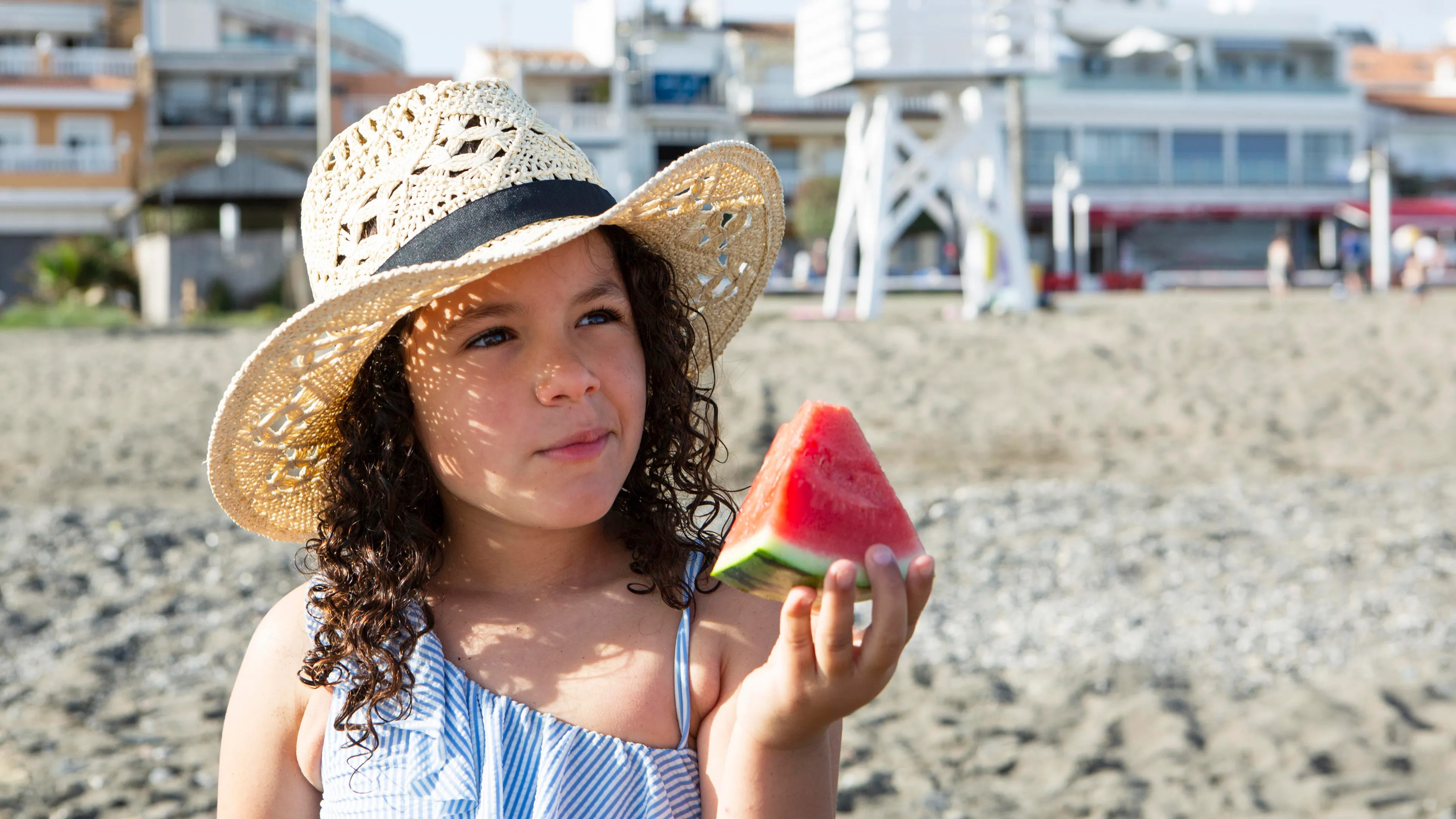 Close up girl holding watermelon slice