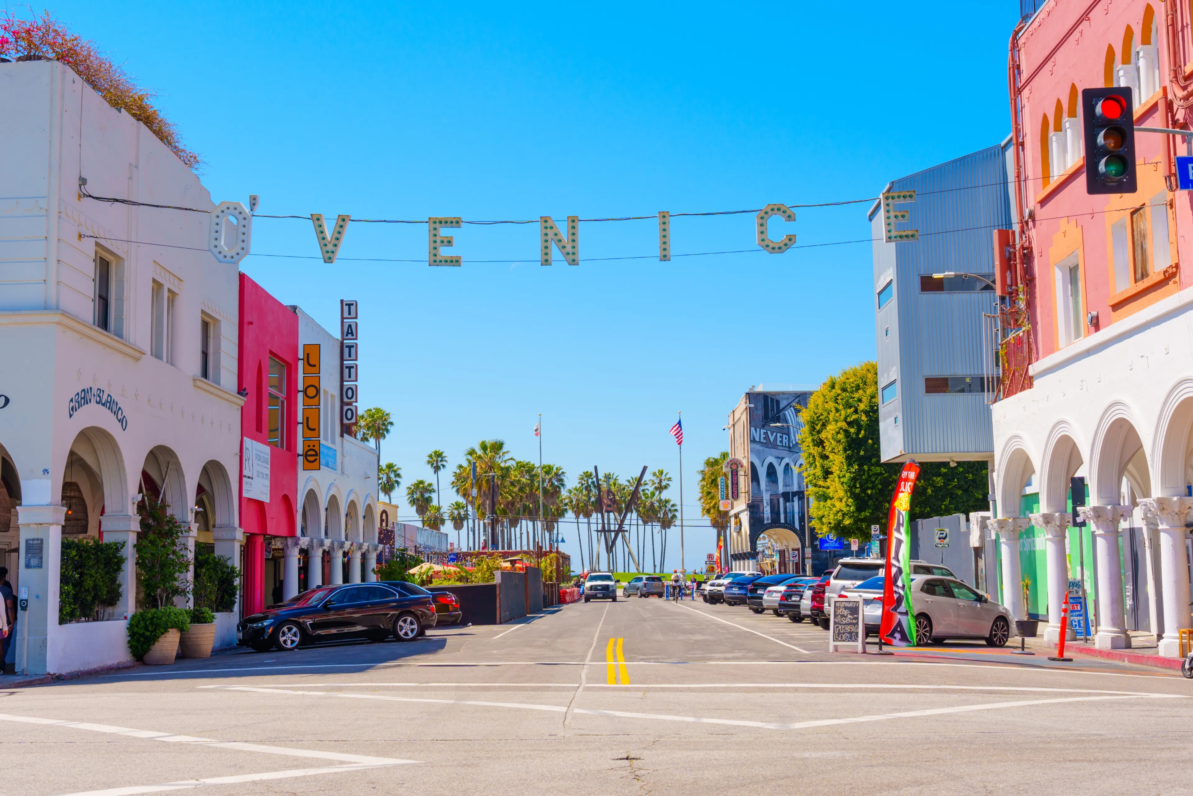 Los Angeles, California - April 3, 2024: Iconic VENICE sign hanging across a street in Venice Beach