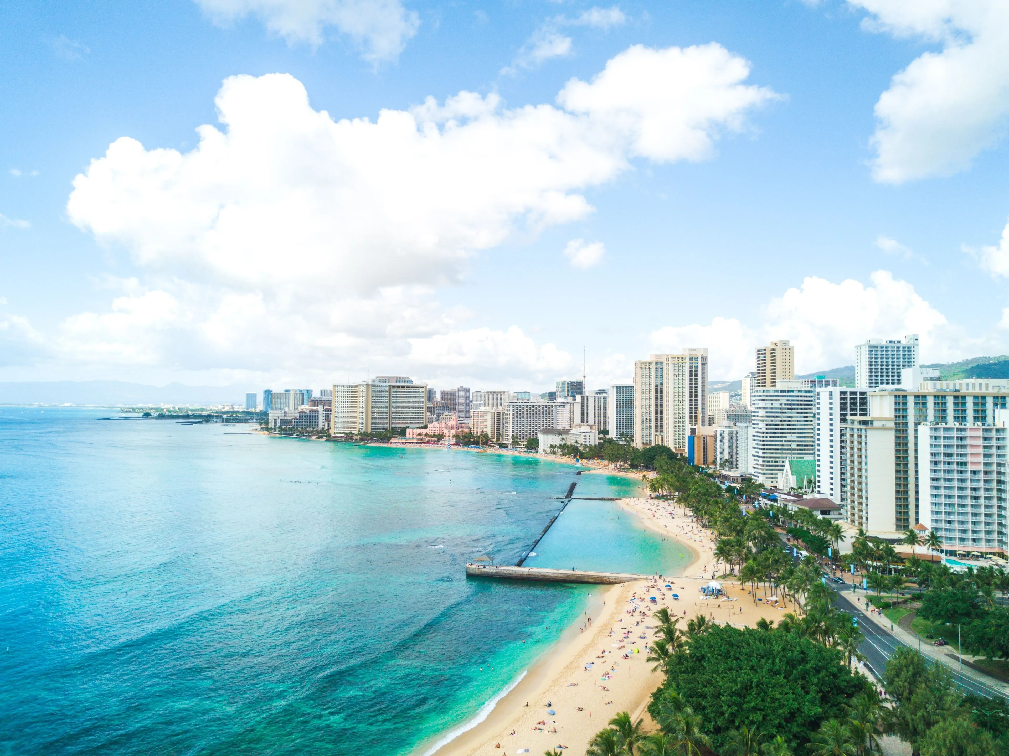 A landscape view of the beautiful Waikiki beach on a sunny day in Hawaii, US