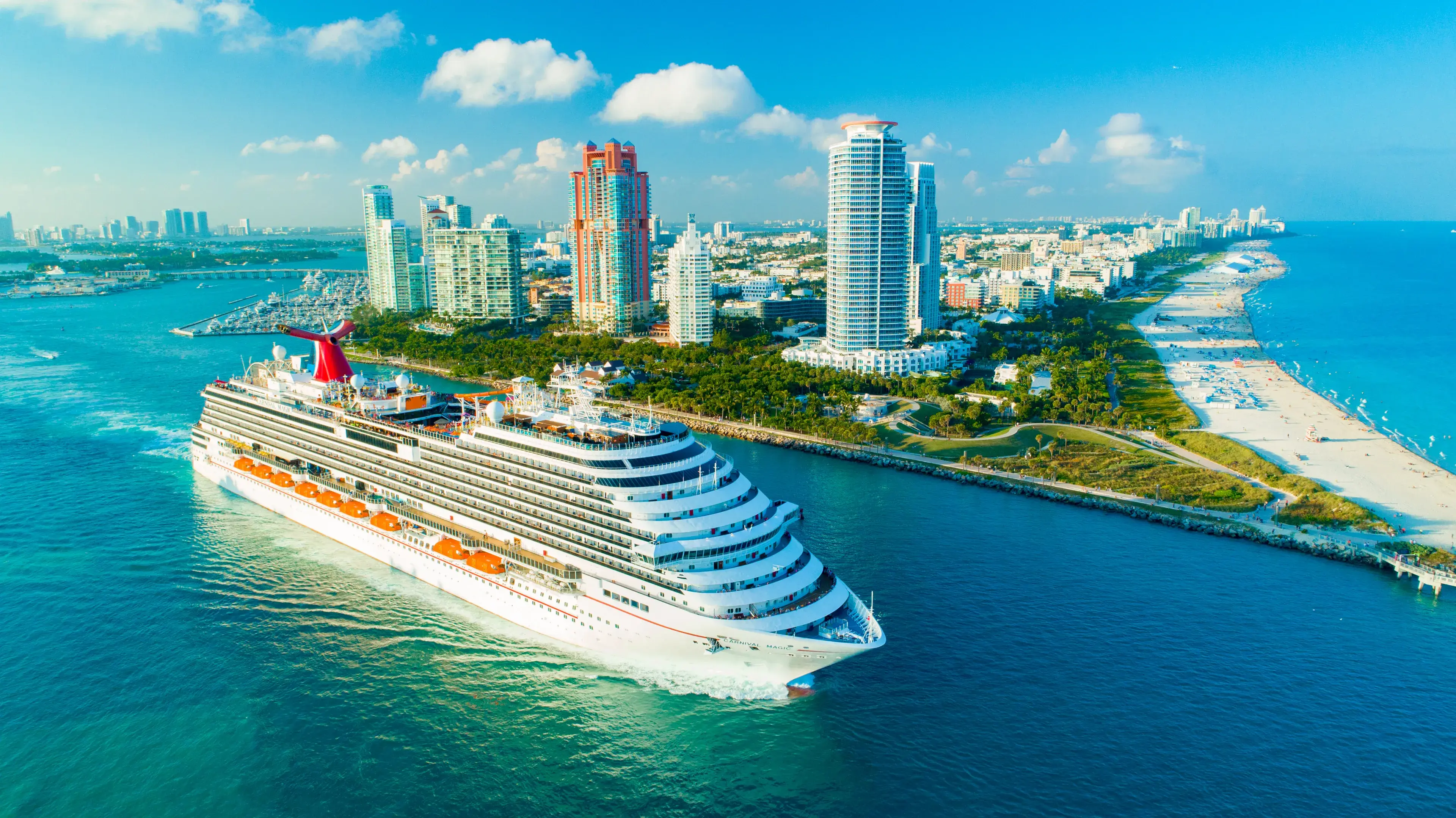 USA. FLORIDA. MIAMI BEACH. DECEMBER, 2018: Cruise ship (Carnival Magic) entrance to Atlantic Ocean, from Miami port. USA. FLORIDA. MIAMI BEACH. DECEMBER, 2018: Cruise ship (Carnival Magic) entrance to Atlantic Ocean, from Miami port.