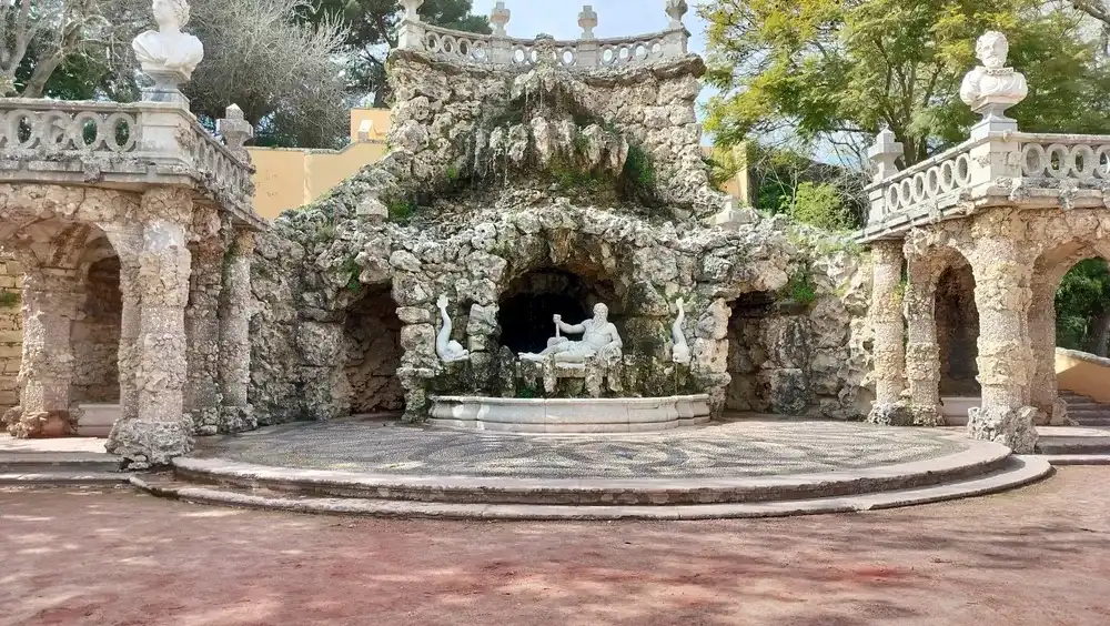 Oeiras, Lisbon, Portugal - March 5, 2024: Poets Waterfall Fountain, Cascata dos Poetas, in the gardens of Marques de Pombal Palace, 18th-century Baroque and Rococo architectural monument Oeiras, Lisbon, Portugal - March 5, 2024: Poets Waterfall Fountain, Cascata dos Poetas, in the gardens of Marques de Pombal Palace, 18th-century Baroque and Rococo architectural monument