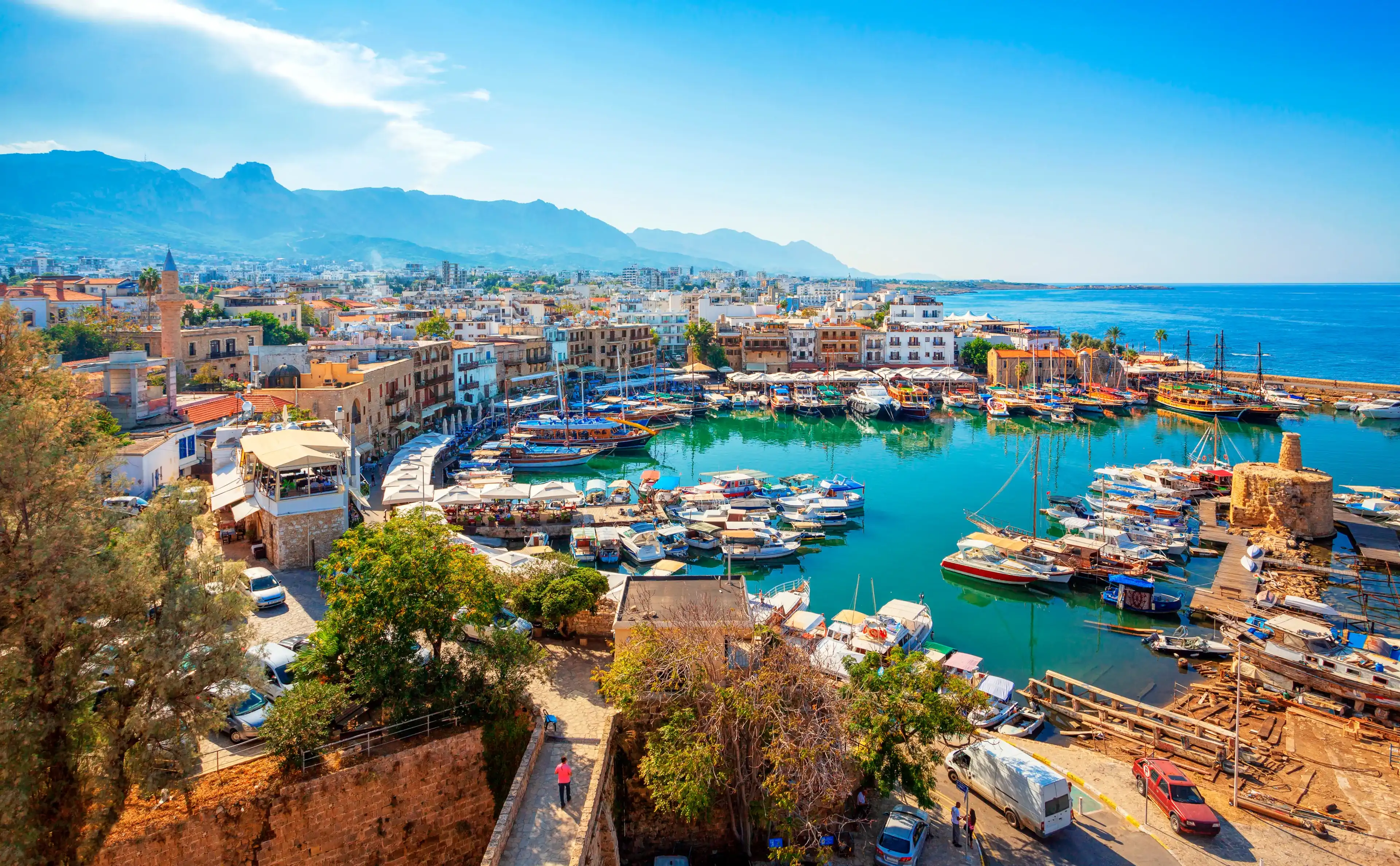 Panoramic view of Kyrenia (Girne) old harbour on the northern coast of Cyprus. Kyrenia seaside of Mediterranean Sea, Cyprus. Famous places and travel destination of Kyrenia, Cyprus