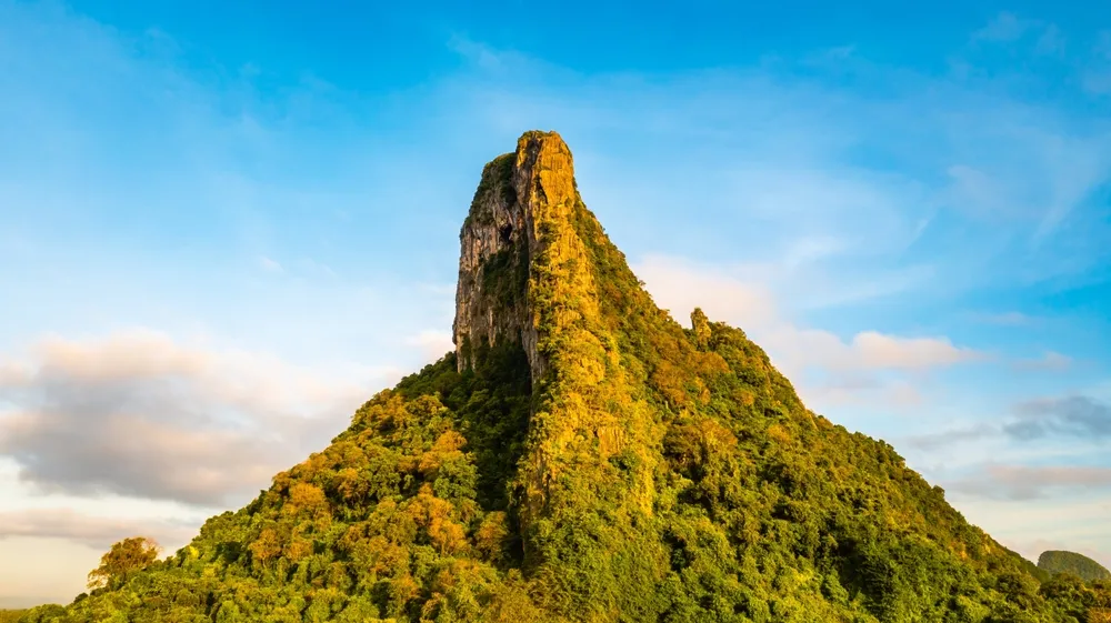 Mountain of Phatthalung city, view from above in the morning with golden sun light. Aerial view panorama of Khao Ok Thalu ,Phatthalung, Thailand.