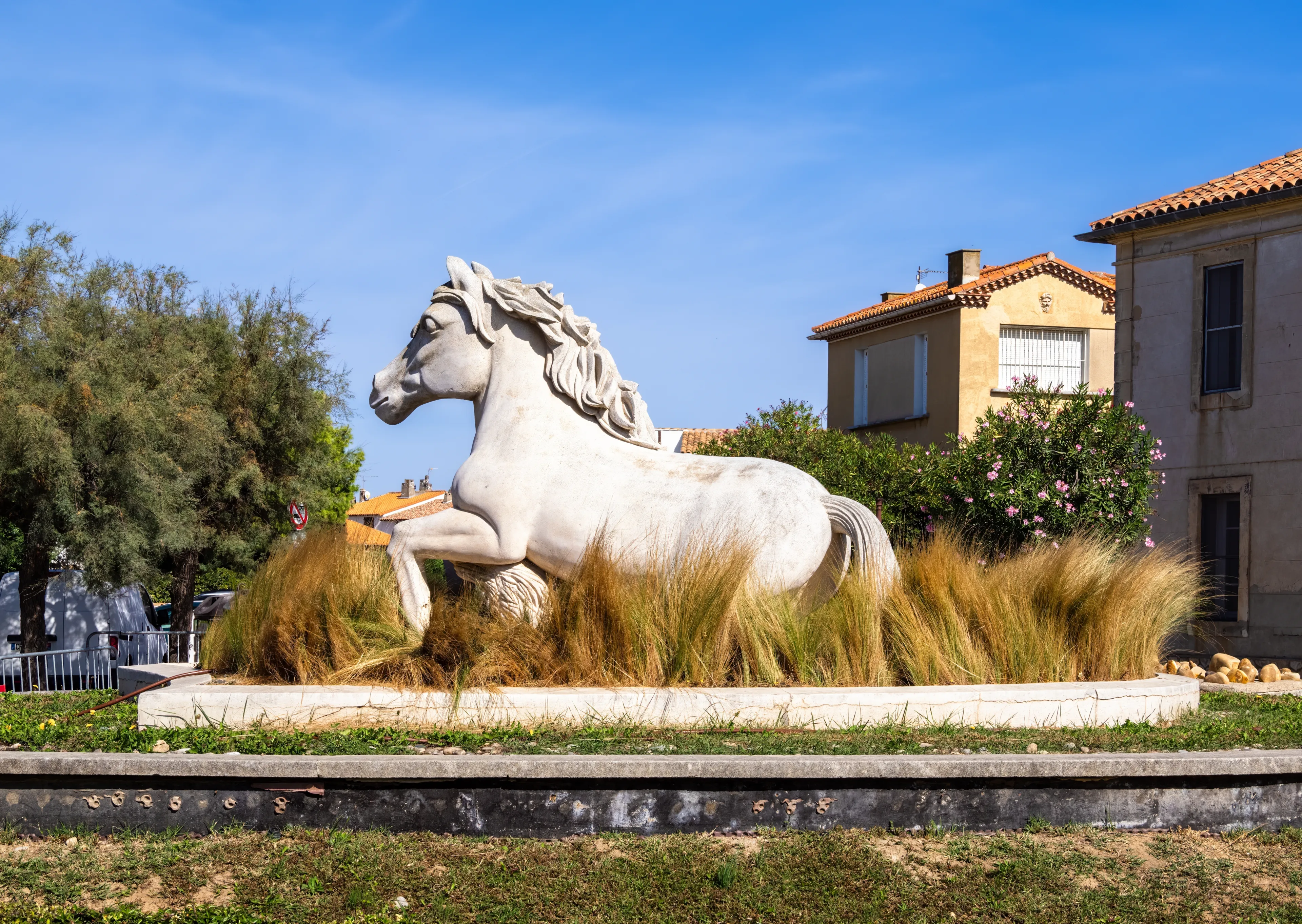 Saintes Maries de la Mer, France - October 3, 2023: A sculpture of a white horse, typical of the Camargue region