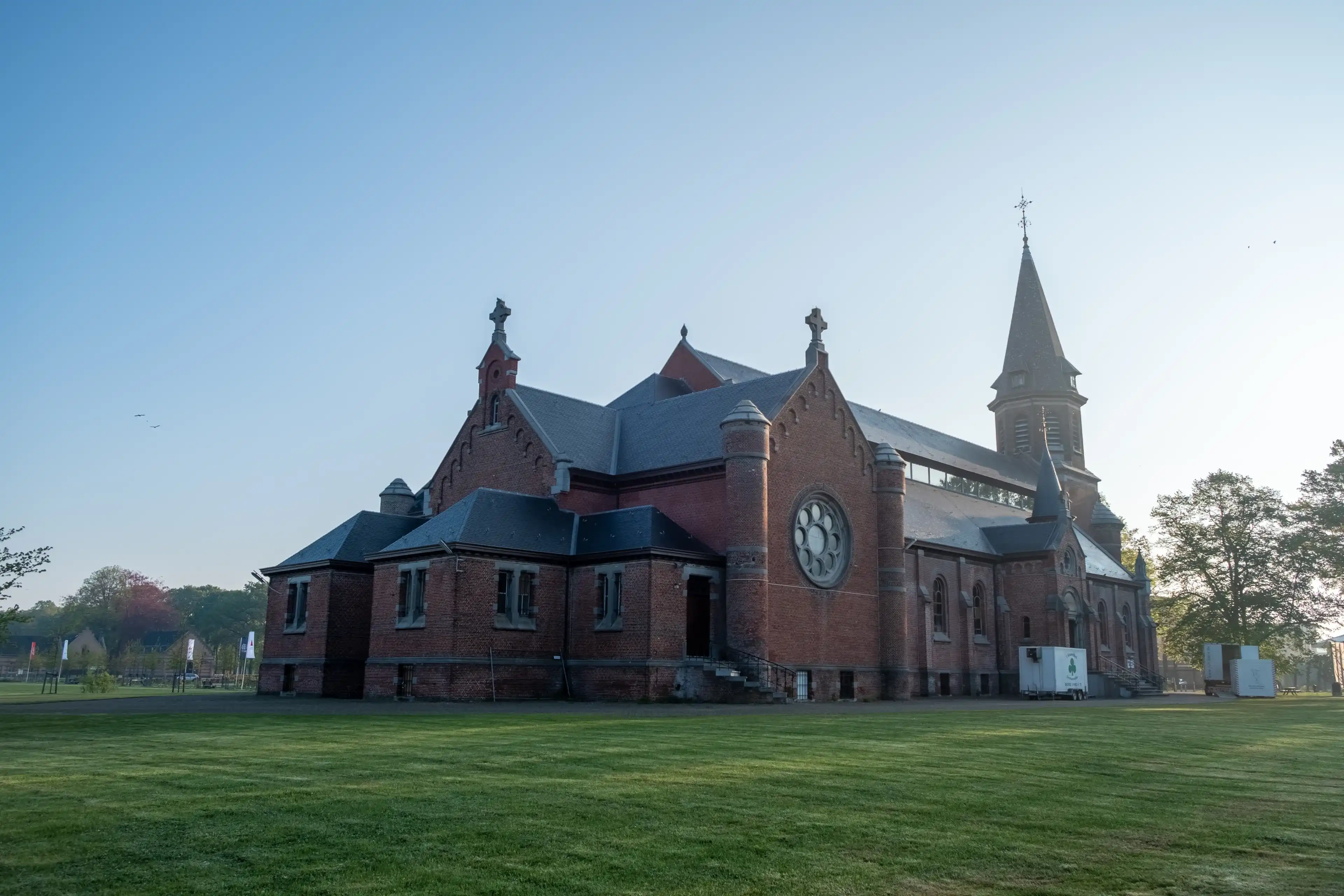 Merksplas, Belgium, April 27th, 2022, The Chapel in Merksplas Colony in the bright sunrise light . High quality photo