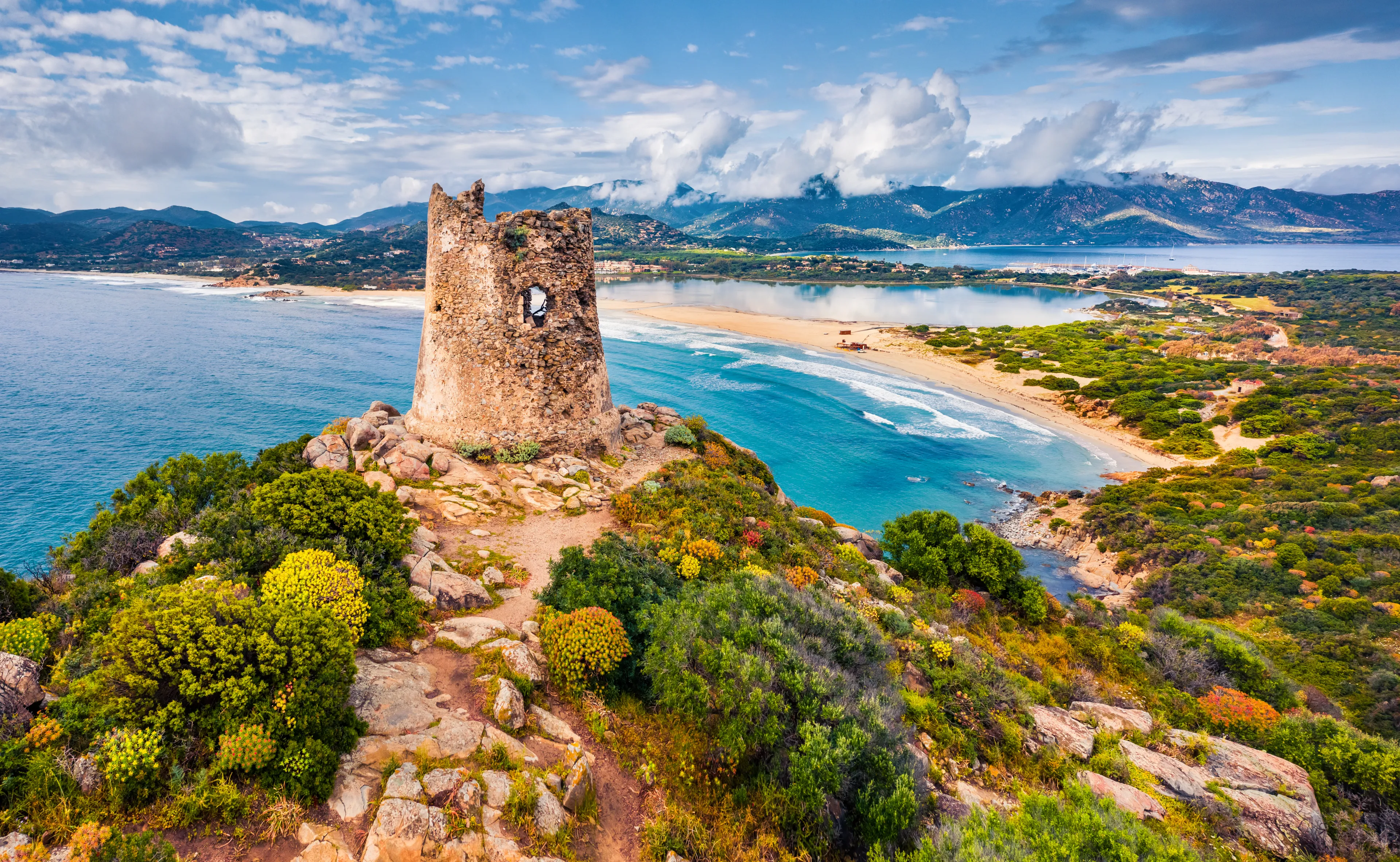 View from flying drone. Colroful spring view of Torre di Porto Giunco tower on Carbonara cape. Fantastic morning scene of Sardinia island, Italy, Europe. Colorful Mediterranean seascape.