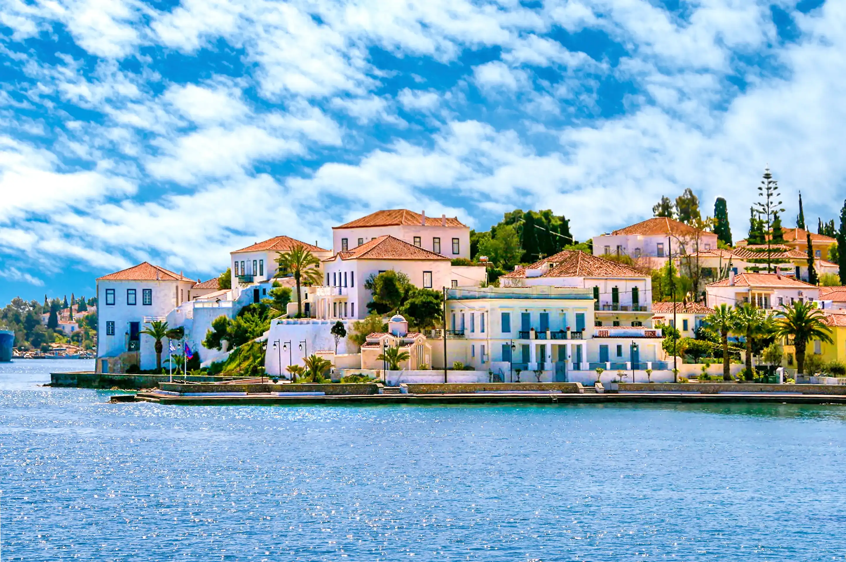 Buildings of Spetses island on Saronic gulf near Athens. Ideal travel destination for quiet vacations . Greece Buildings of Spetses island on Saronic gulf near Athens. Ideal travel destination for quiet vacations . Greece