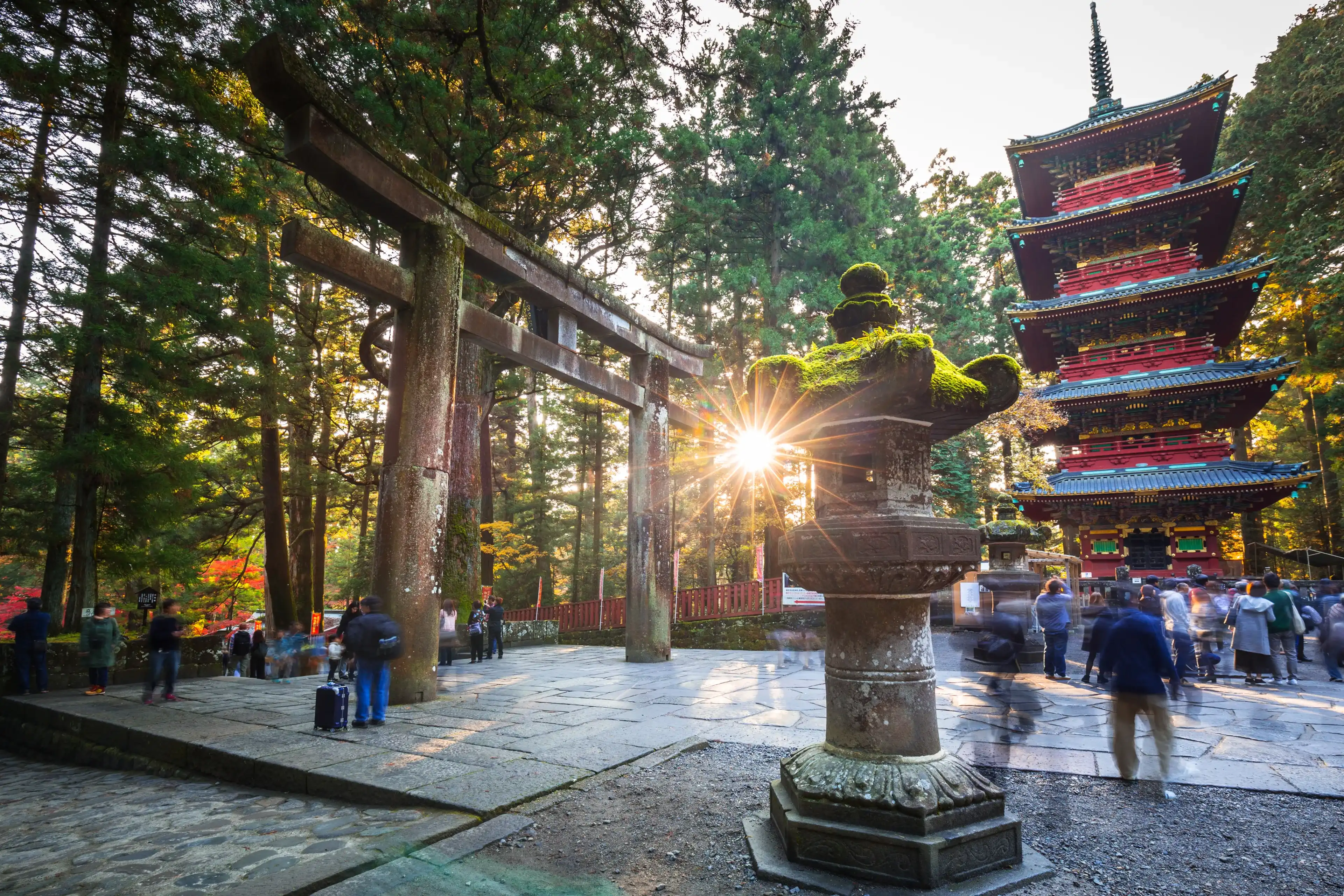 NIKKO, JAPAN - NOVEMBER 13, 2016: Tourists at Toshogu Shrine temple in Nikko, Japan. Nikko is a popular destination for many international tourists with Tosho-gu temple, a UNESCO World Heritage Site. NIKKO, JAPAN - NOVEMBER 13, 2016: Tourists at Toshogu Shrine temple in Nikko, Japan. Nikko is a popular destination for many international tourists with Tosho-gu temple, a UNESCO World Heritage Site.