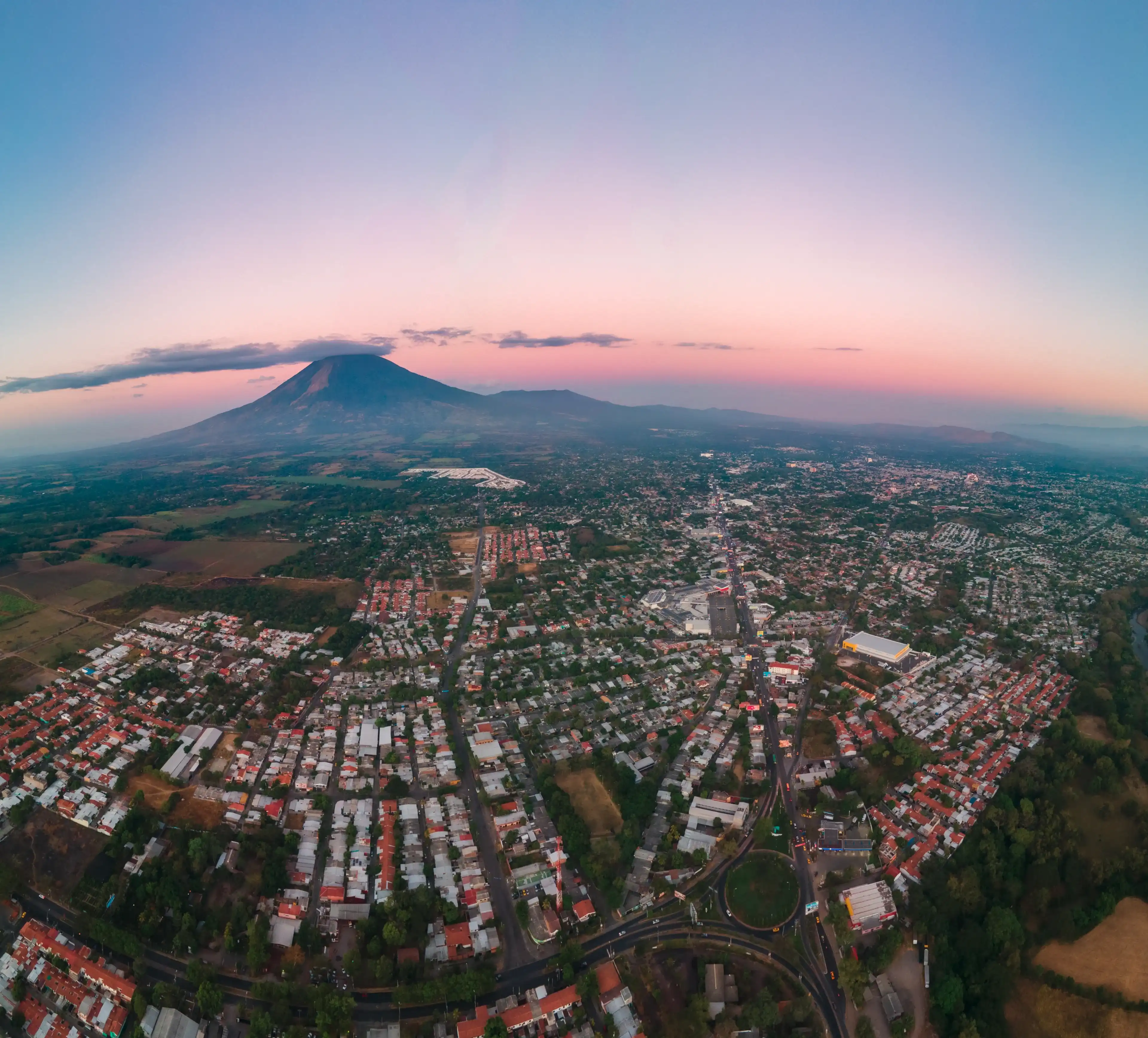 city ​​of san miguel, el salvador with chaparrastique volcano in the background at morning from aerial view