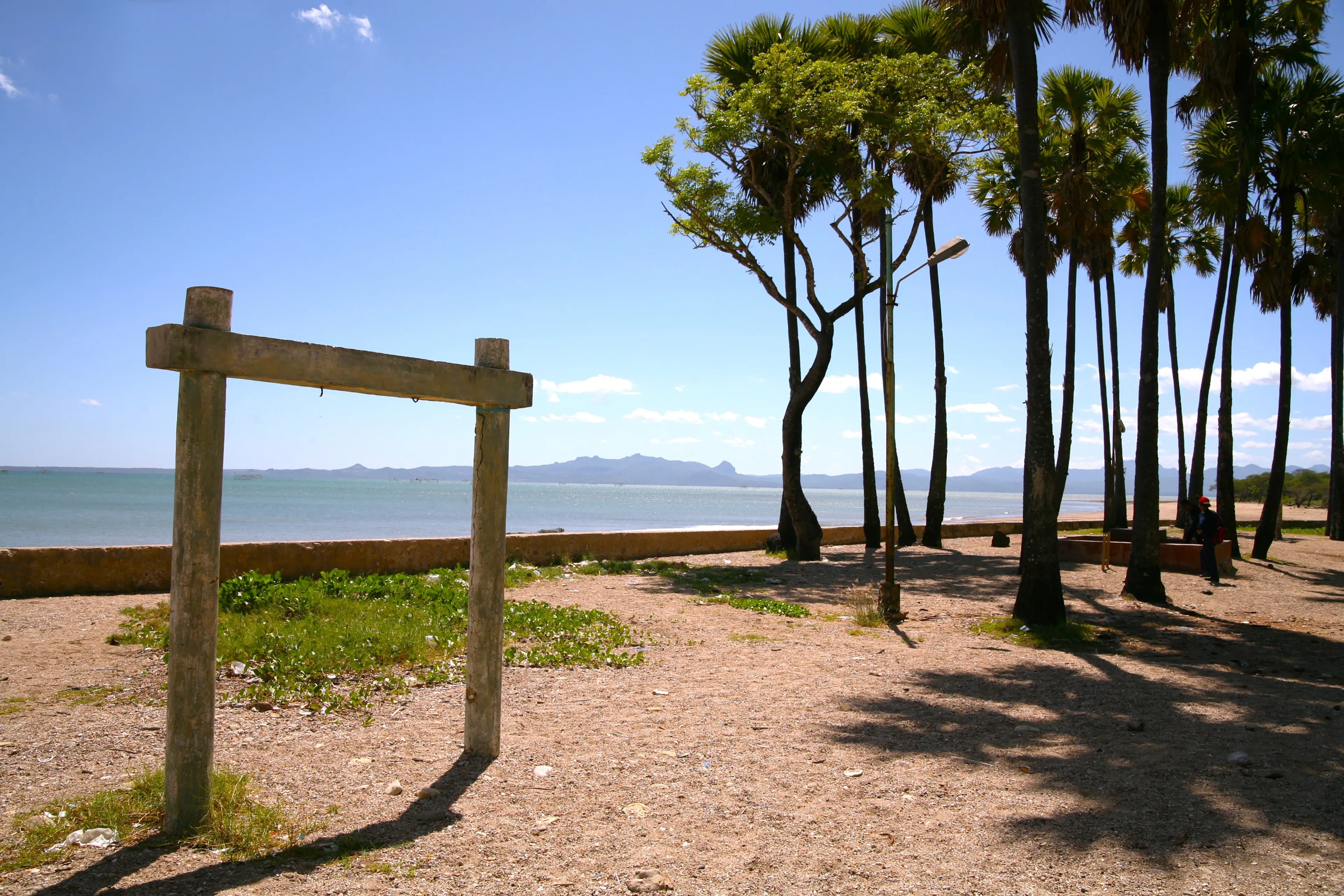 Lusiana Beach, Kupang. May 23, 2014. View of the beach "Lusiana" with broken swings and towering trees. Location Kupang, Indonesia.