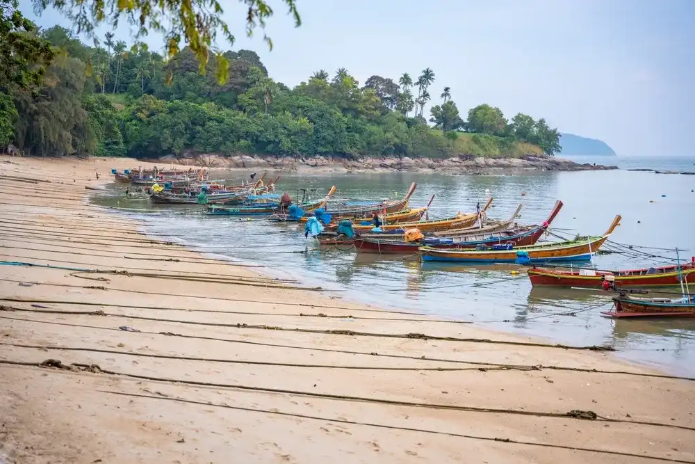 Rawai, Thailand - December 12, 2023: Fishing boats at Rawai beach after day work in Thailand. High quality photo Rawai, Thailand - December 12, 2023: Fishing boats at Rawai beach after day work in Thailand. High quality photo