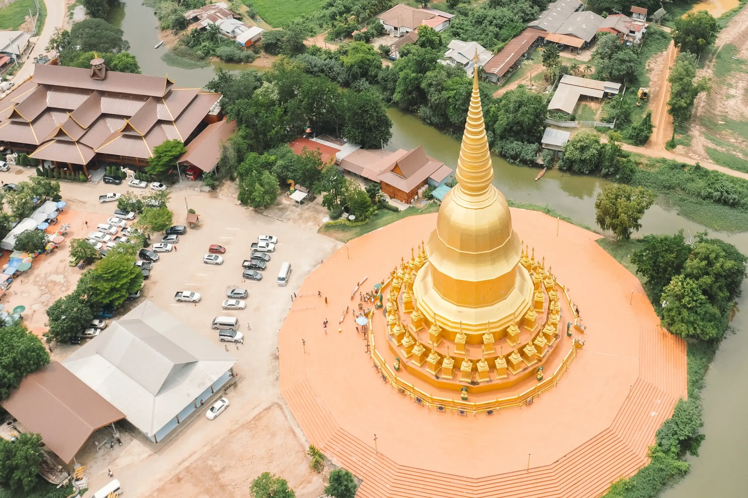 Golden Chedi and Naga Sculpture at Wat Pa Wang Nam Yen, Maha Sarakham, Thailand Golden Chedi and Naga Sculpture at Wat Pa Wang Nam Yen, Maha Sarakham, Thailand