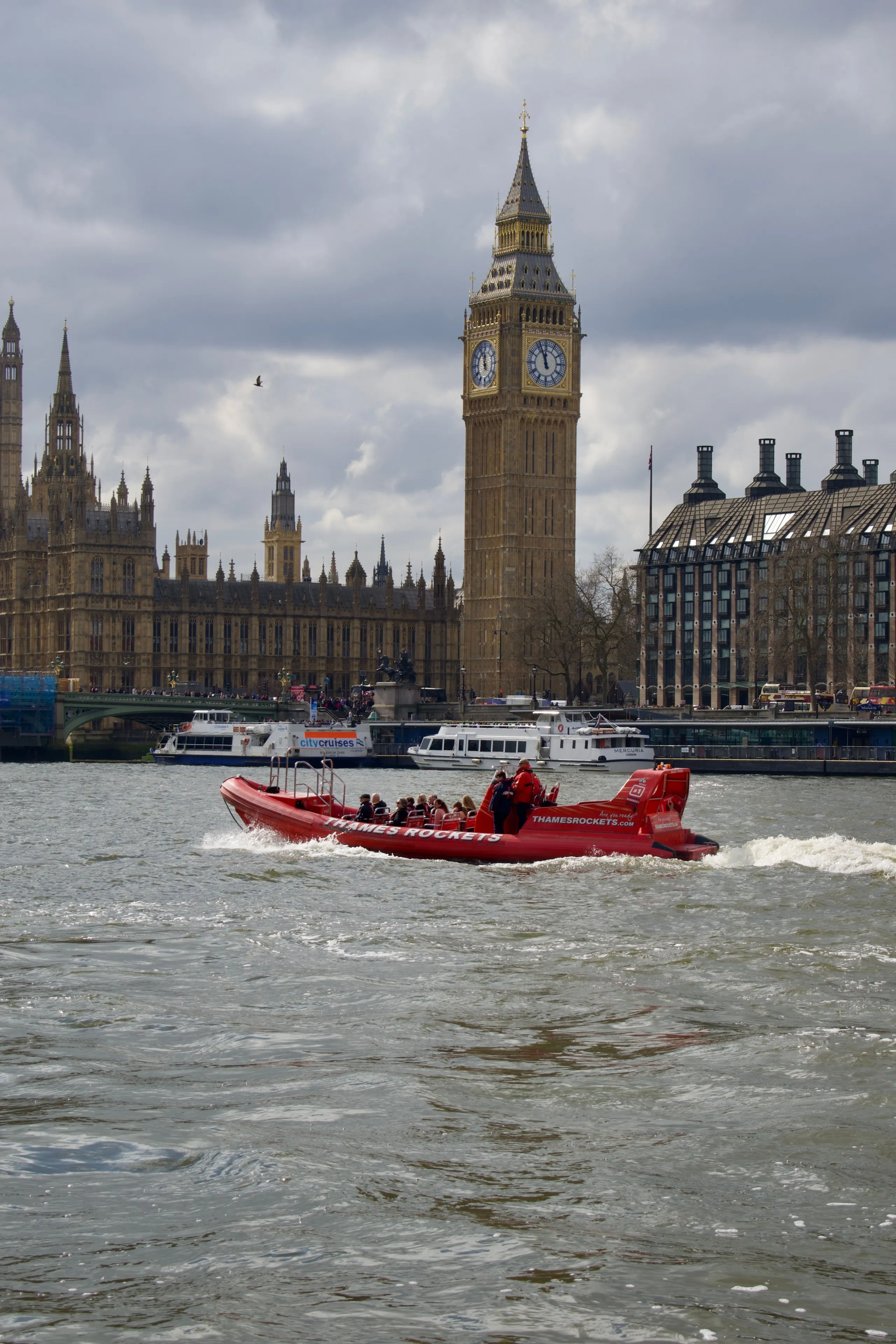 A dynamic view of Big Ben with a vibrant boat on the Thames, capturing London's iconic architecture.