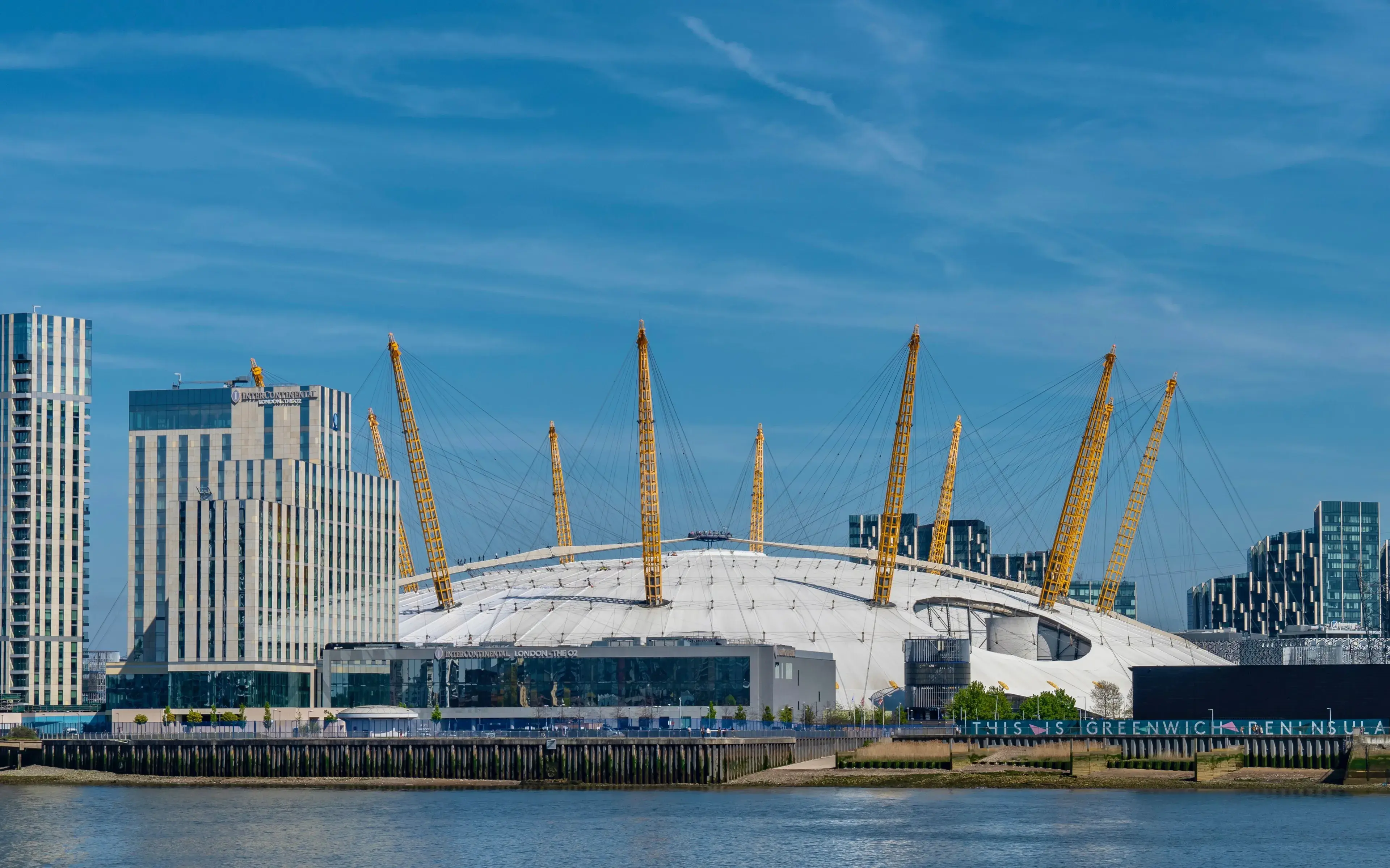 View of the O2 Arena and city skyline along the River Thames in London, UK View of the O2 Arena and city skyline along the River Thames in London, UK