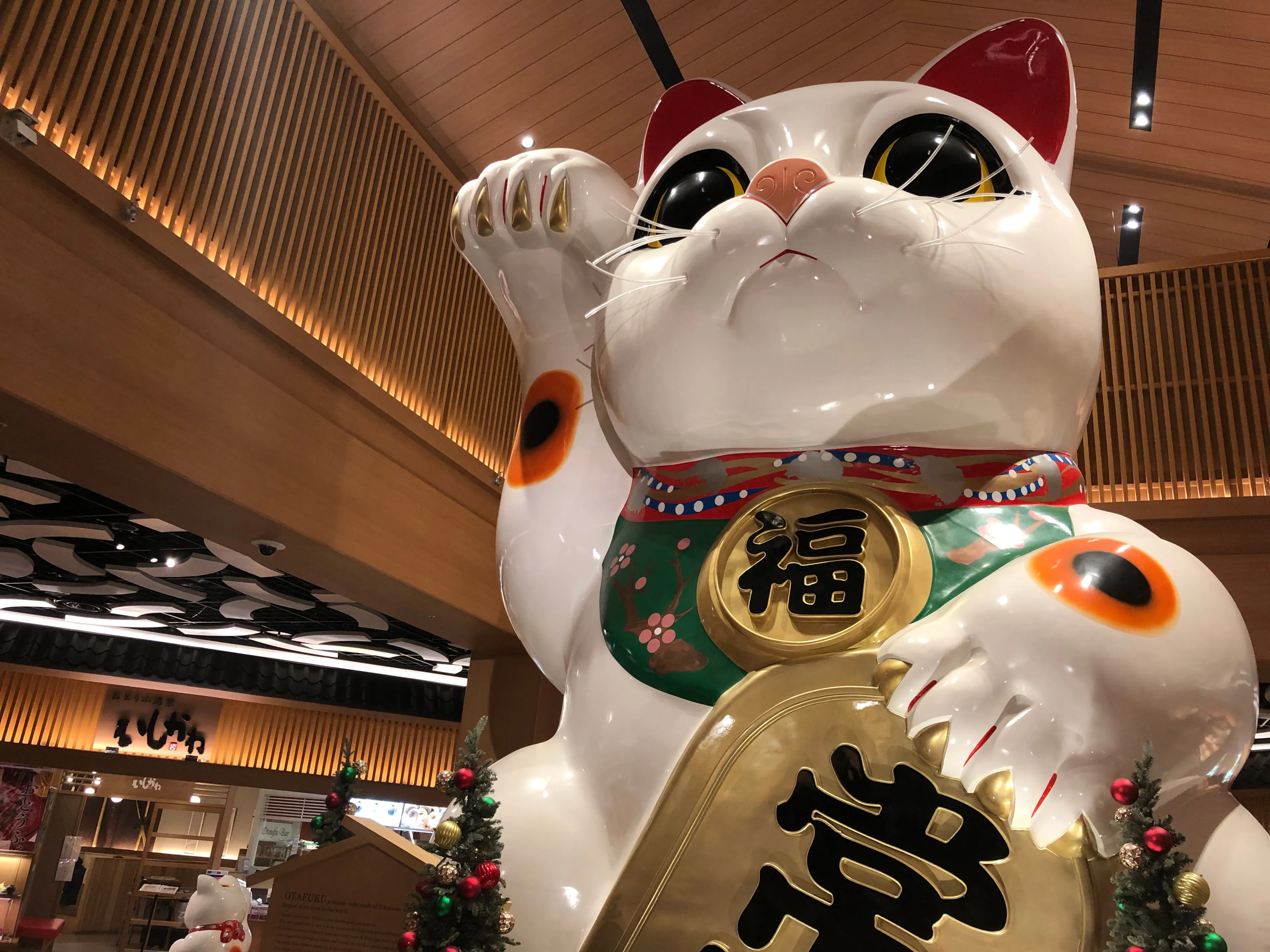 AICHI/JAPAN-Nov 28, 2019: “Otafuku”, giant Manekineko (lucky cat) statue inside AEON Mall Tokoname (TRANSLATION: Happiness/ Tokoname).
