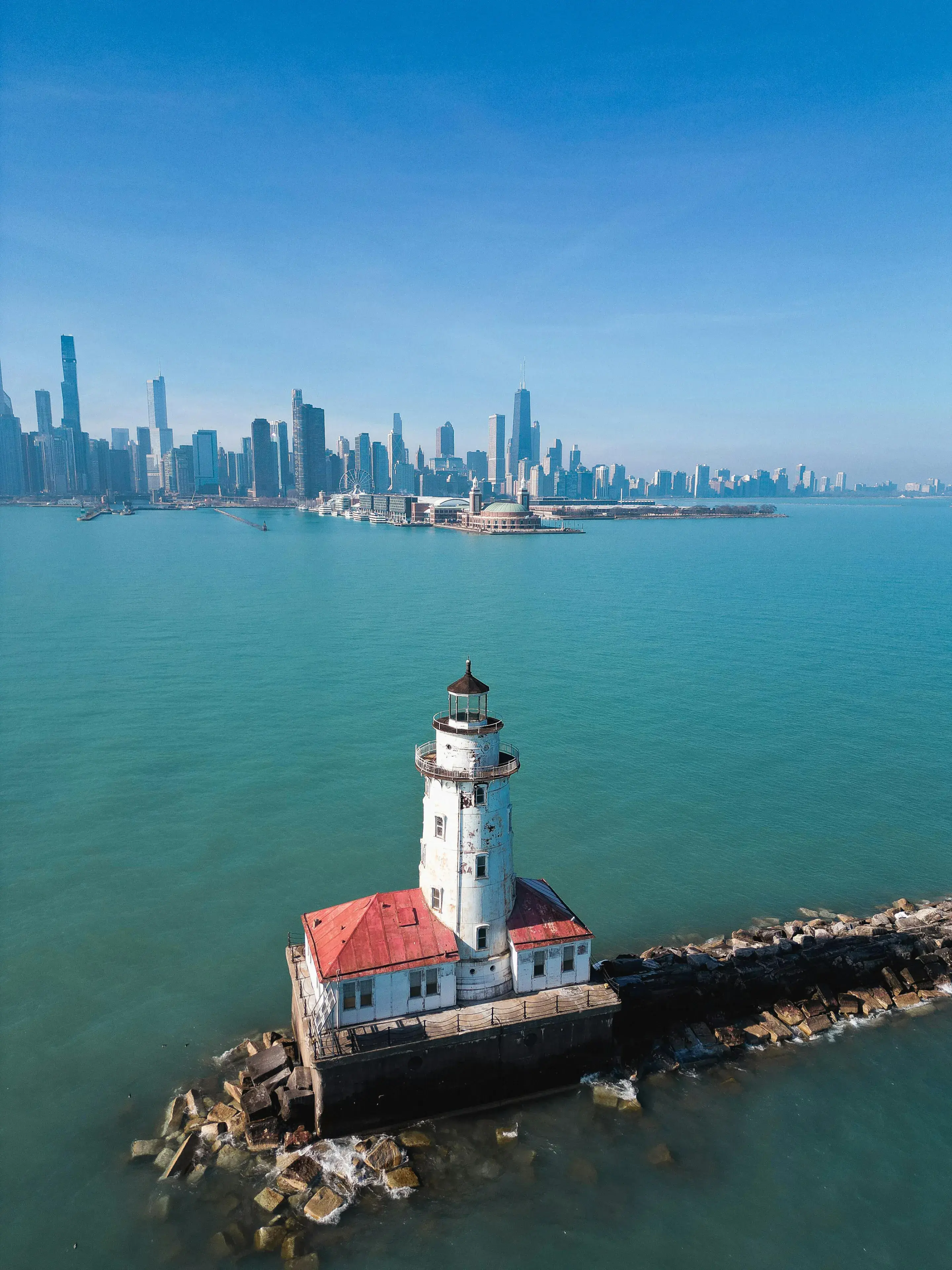 Aerial View of the Chicago Harbor Light and Chicago Skyline in the Background Aerial View of the Chicago Harbor Light and Chicago Skyline in the Background