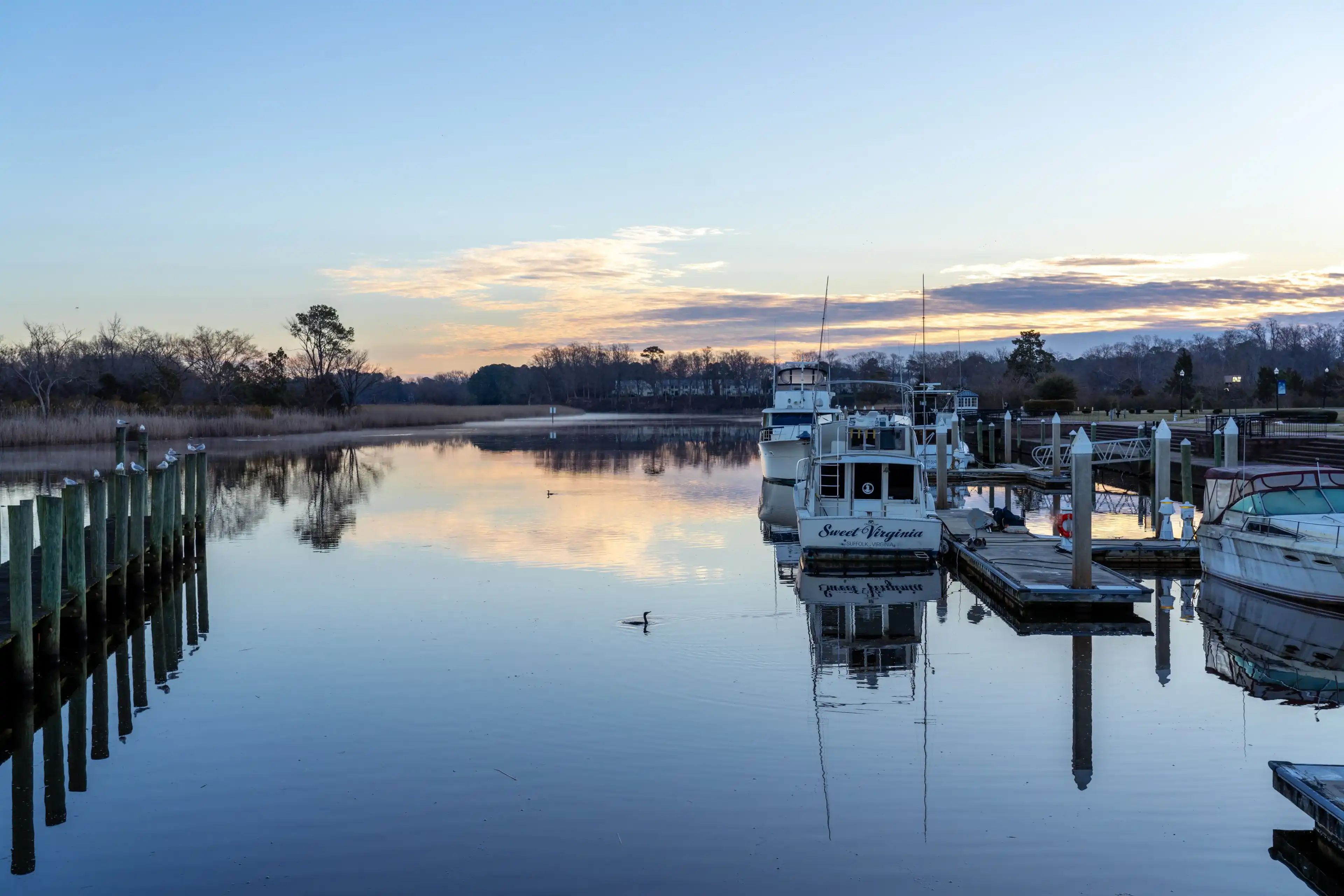 Suffolk Virginia - February 19 2024: Boats Docked on the Nansemond River in Downtown Suffolk Virginia Suffolk Virginia - February 19 2024: Boats Docked on the Nansemond River in Downtown Suffolk Virginia