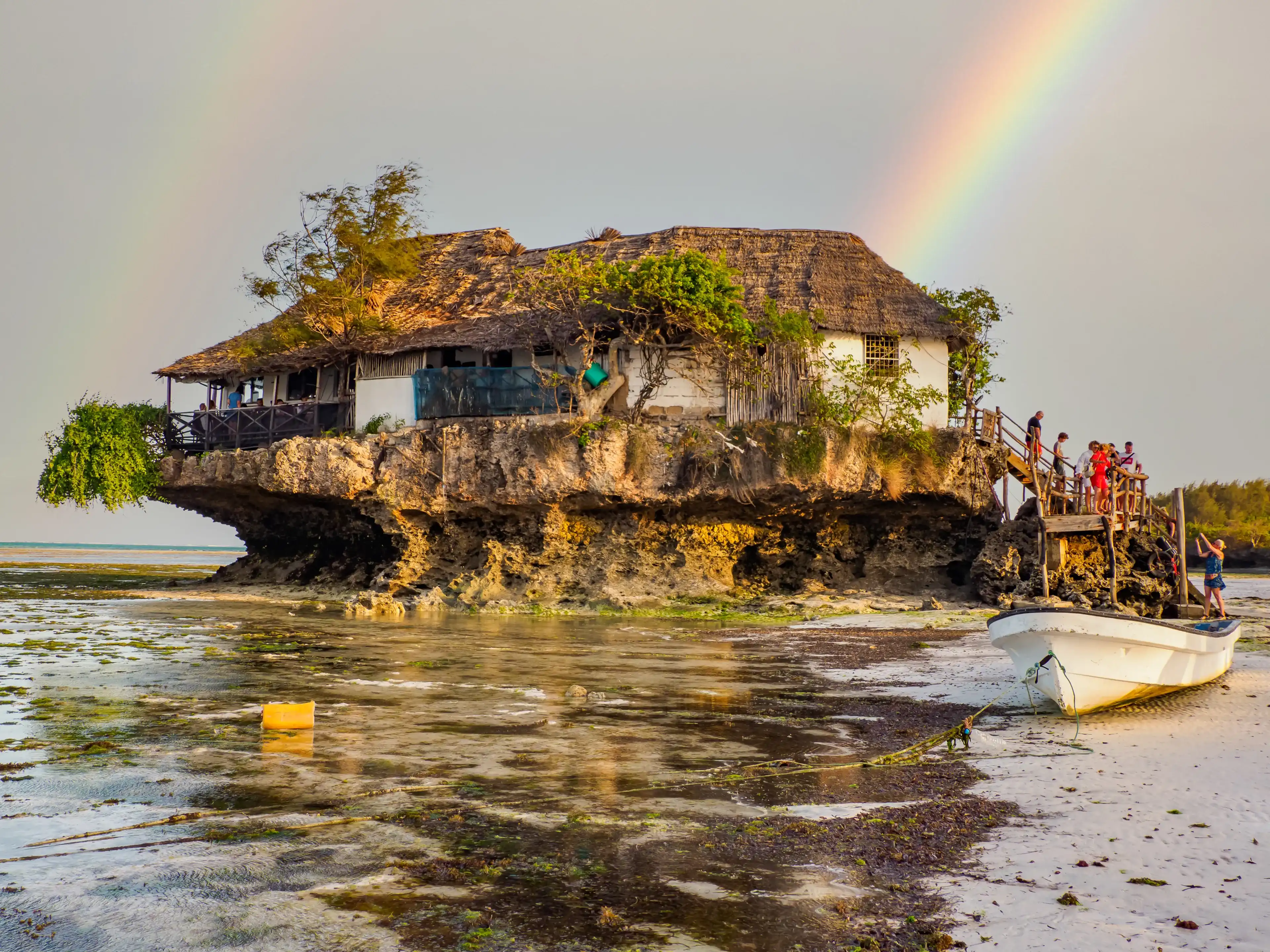 Michamvi, Tanzania - Feb, 2021: Famous 'The Rock' restaurant built on the cliff in the sea by the Pingwe beach at Zanzibar, Africa Michamvi, Tanzania - Feb, 2021: Famous 'The Rock' restaurant built on the cliff in the sea by the Pingwe beach at Zanzibar, Africa