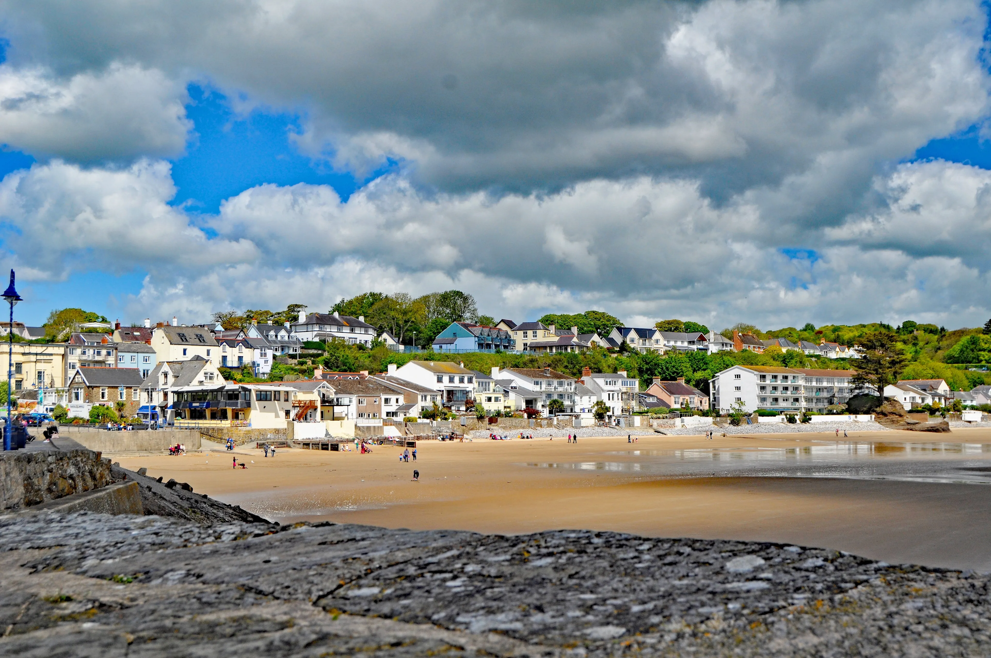 A View of the pretty Beach In Saundersfoot a popular holiday resort in Wales U.K. with Ominous dark clouds.