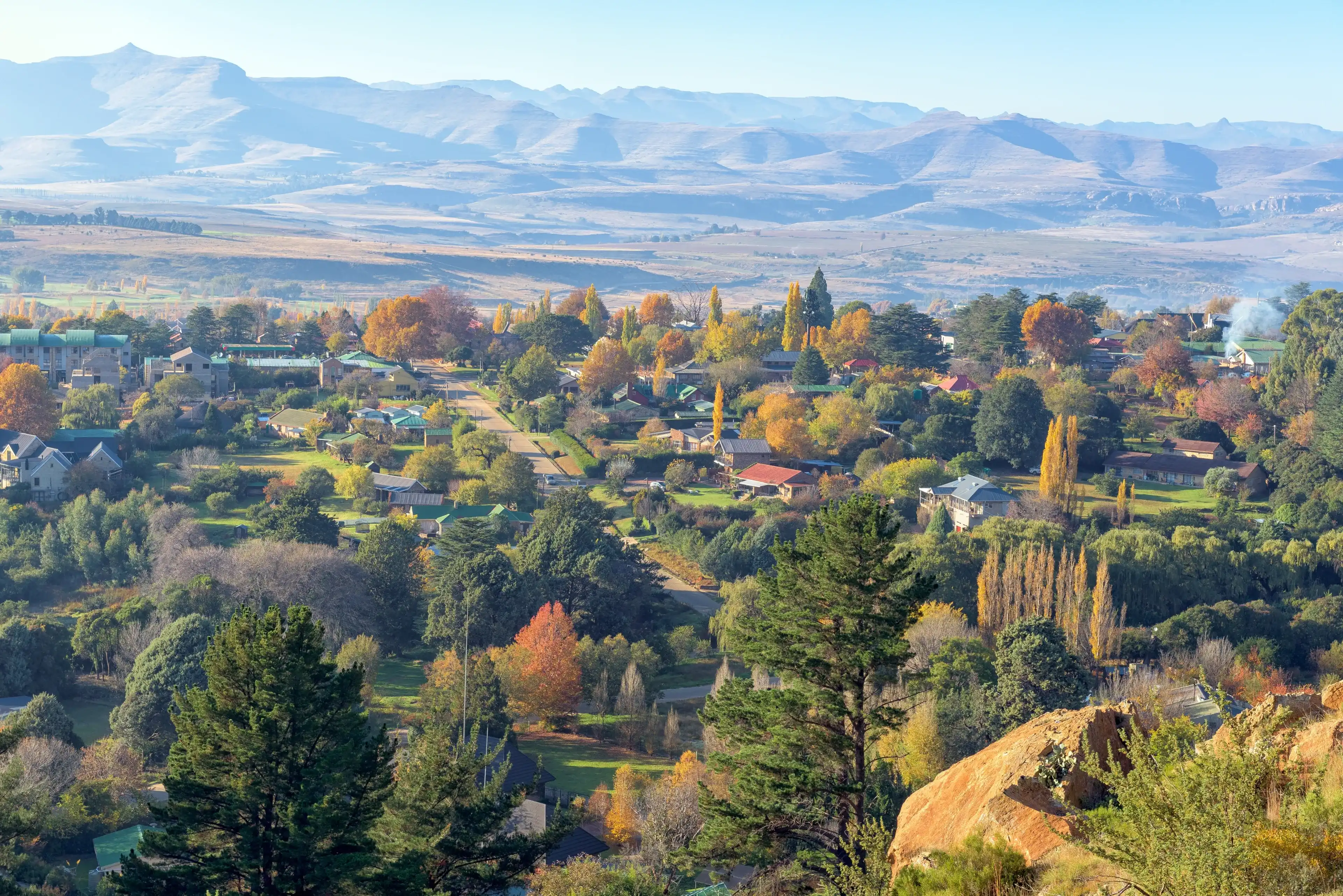 Clarens, South Africa - May 5, 2025: An aerial view of Clarens in autumn colors as seen from the Clarens Mountain Trail. Buidings are visible. Clarens, South Africa - May 5, 2025: An aerial view of Clarens in autumn colors as seen from the Clarens Mountain Trail. Buidings are visible.