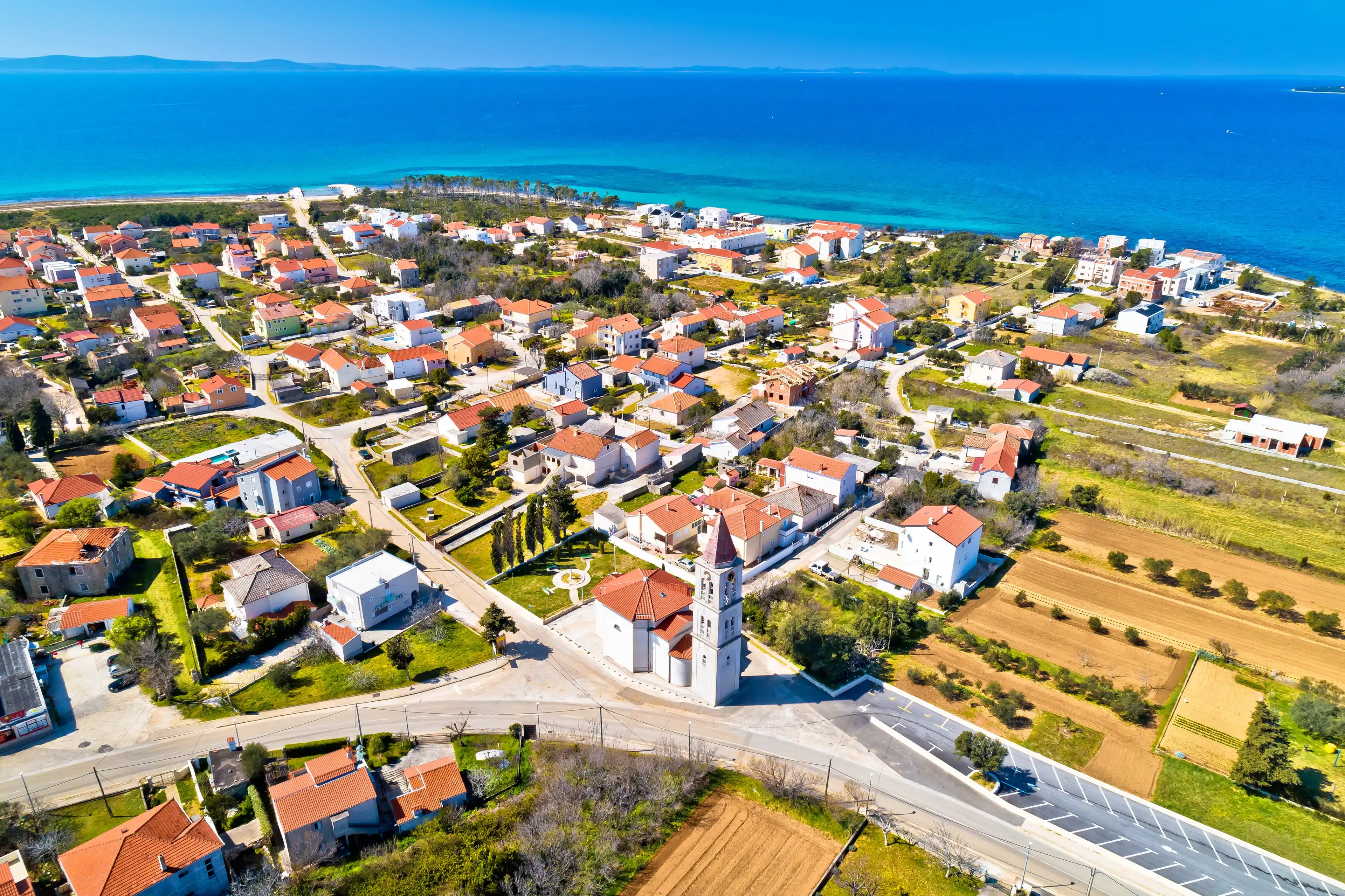 Privlaka village near Zadar tourist destination church and waterfront aerial view, Dalmatia region of Croatia