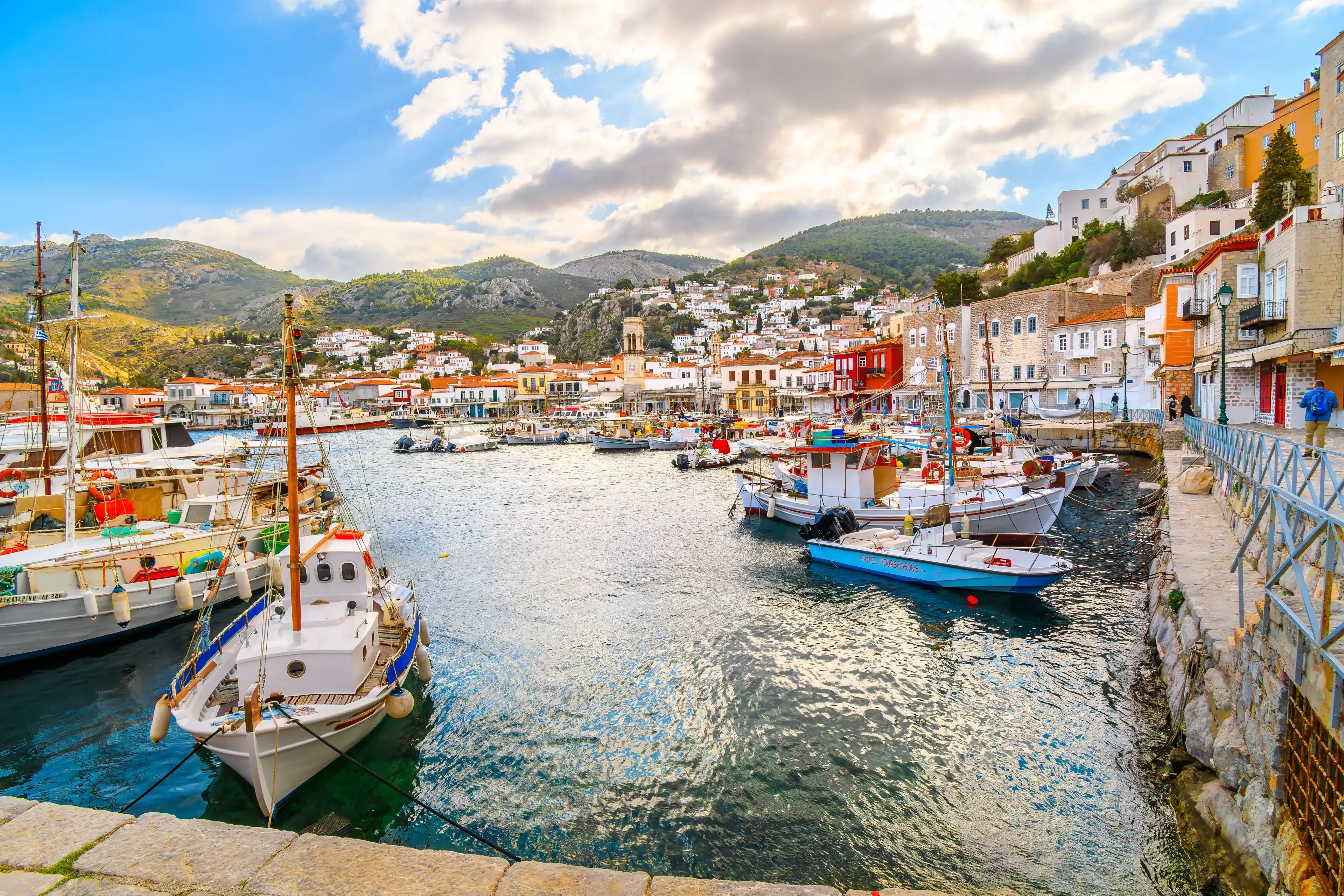 Hydra, Greece - November 8 2023: The harbor and port at the Greek island waterfront village of Hydra, one of the Saronic islands of Greece. Hydra, Greece - November 8 2023: The harbor and port at the Greek island waterfront village of Hydra, one of the Saronic islands of Greece.