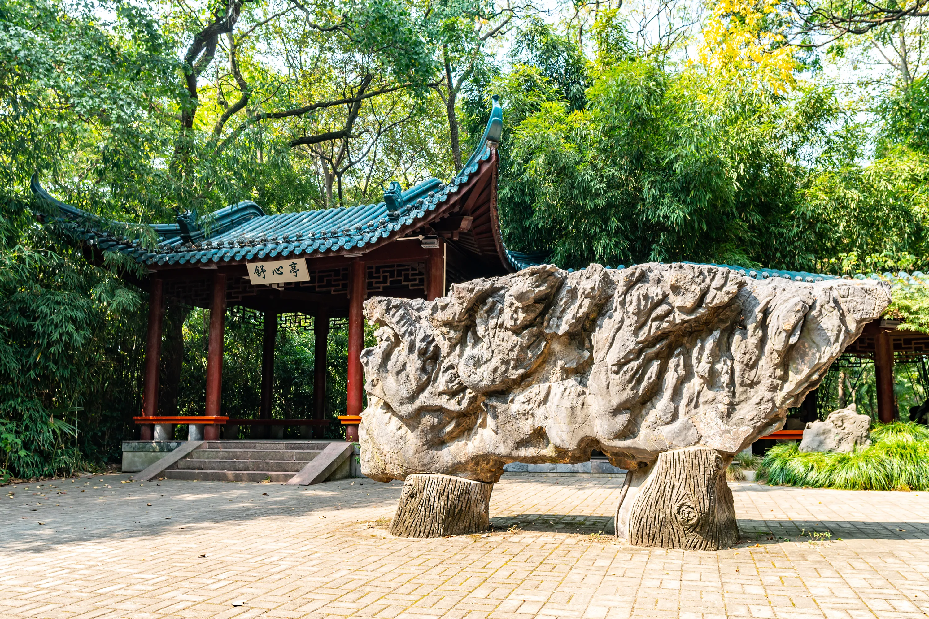 WUHU, CHINA - OCTOBER 2019: Anhui Zheshan Gongyuan Park Picturesque Shuxinting Pavilion Frontal View with Rock Sculpture