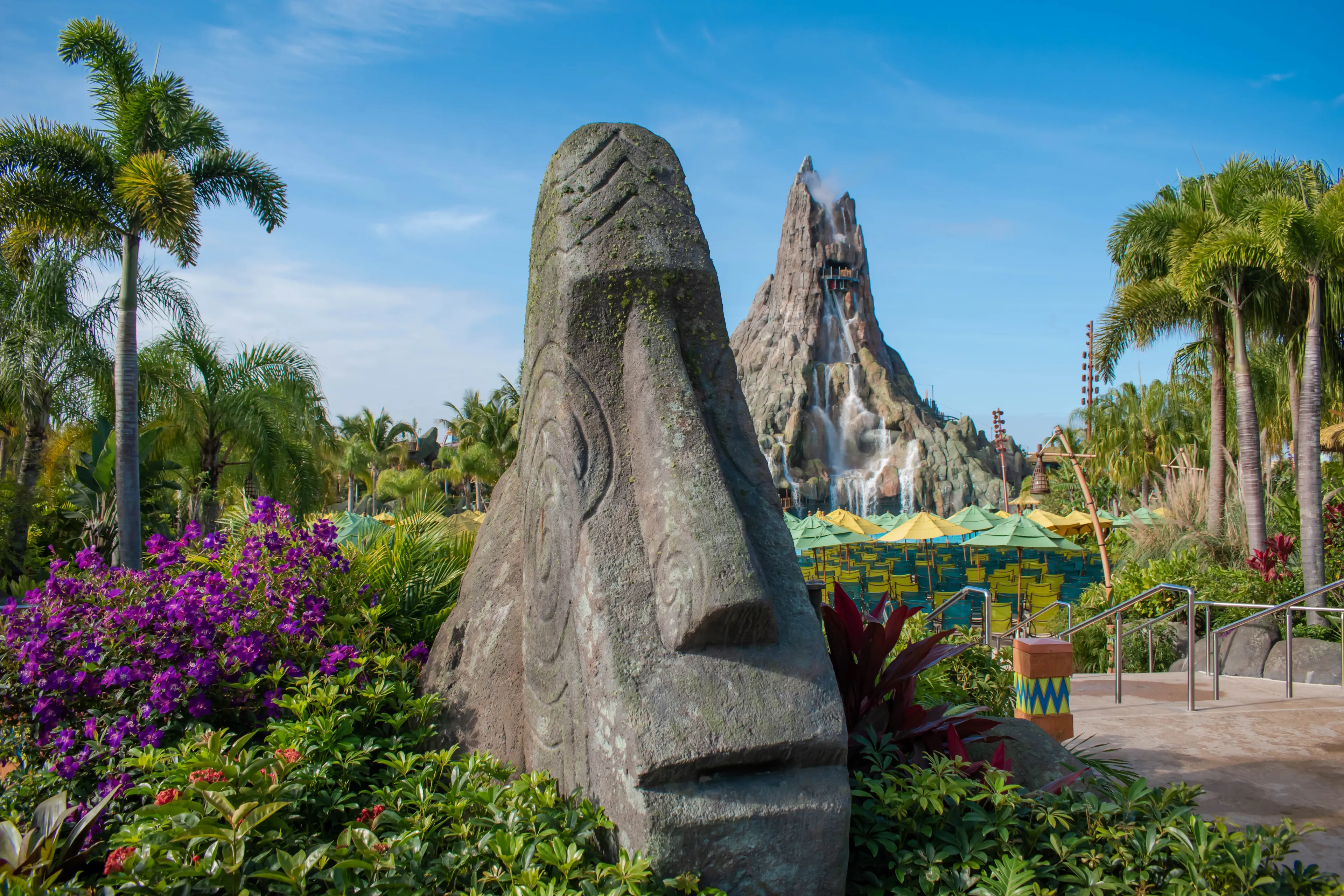 Orlando, Florida. March 10, 2020. Moai stone statue and Krakatau volcano at Volcano Bay in Universal Studios area 1