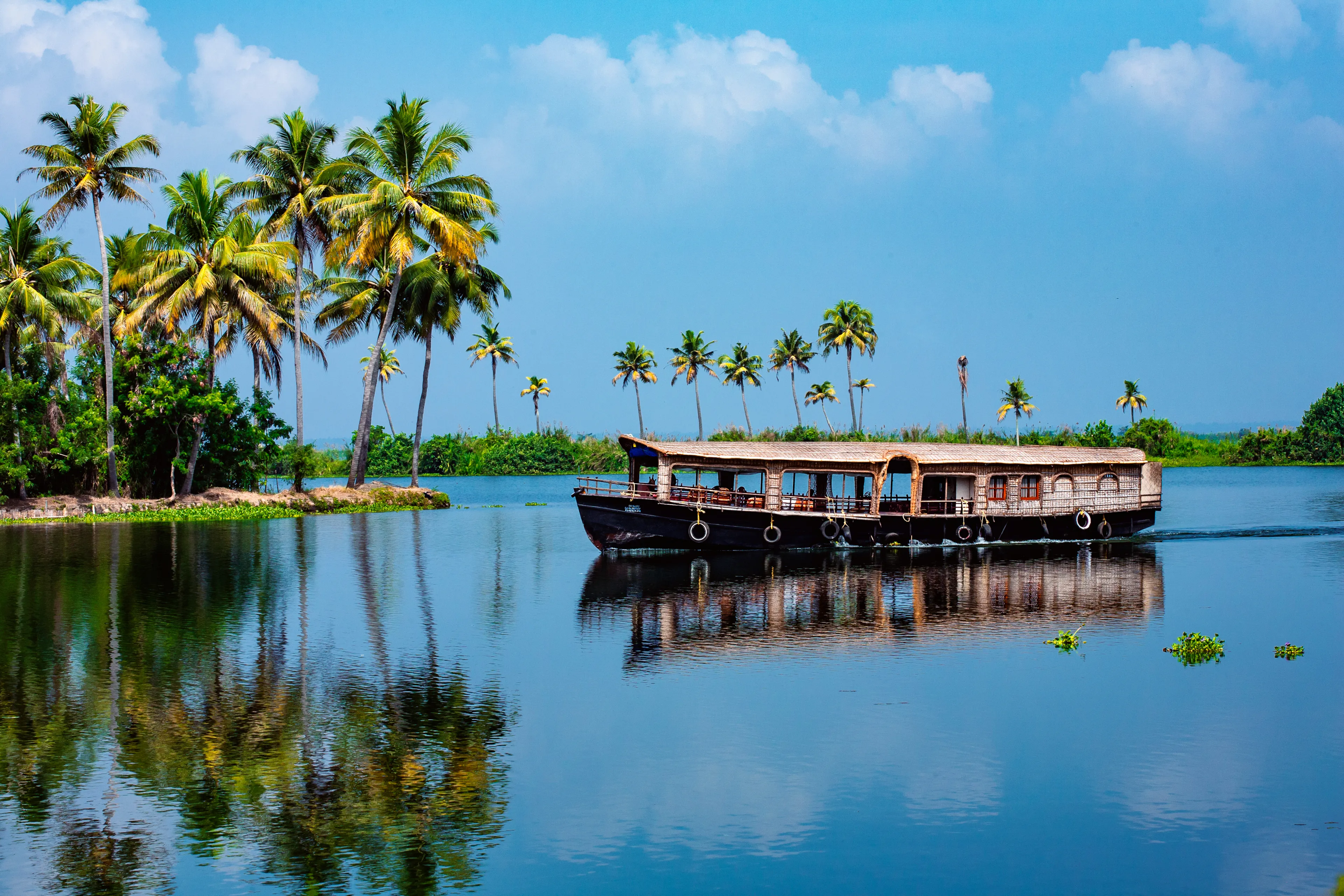 Travel tourism Kerala background - houseboat on Alleppey backwaters.  India.Kerala houseboat image
