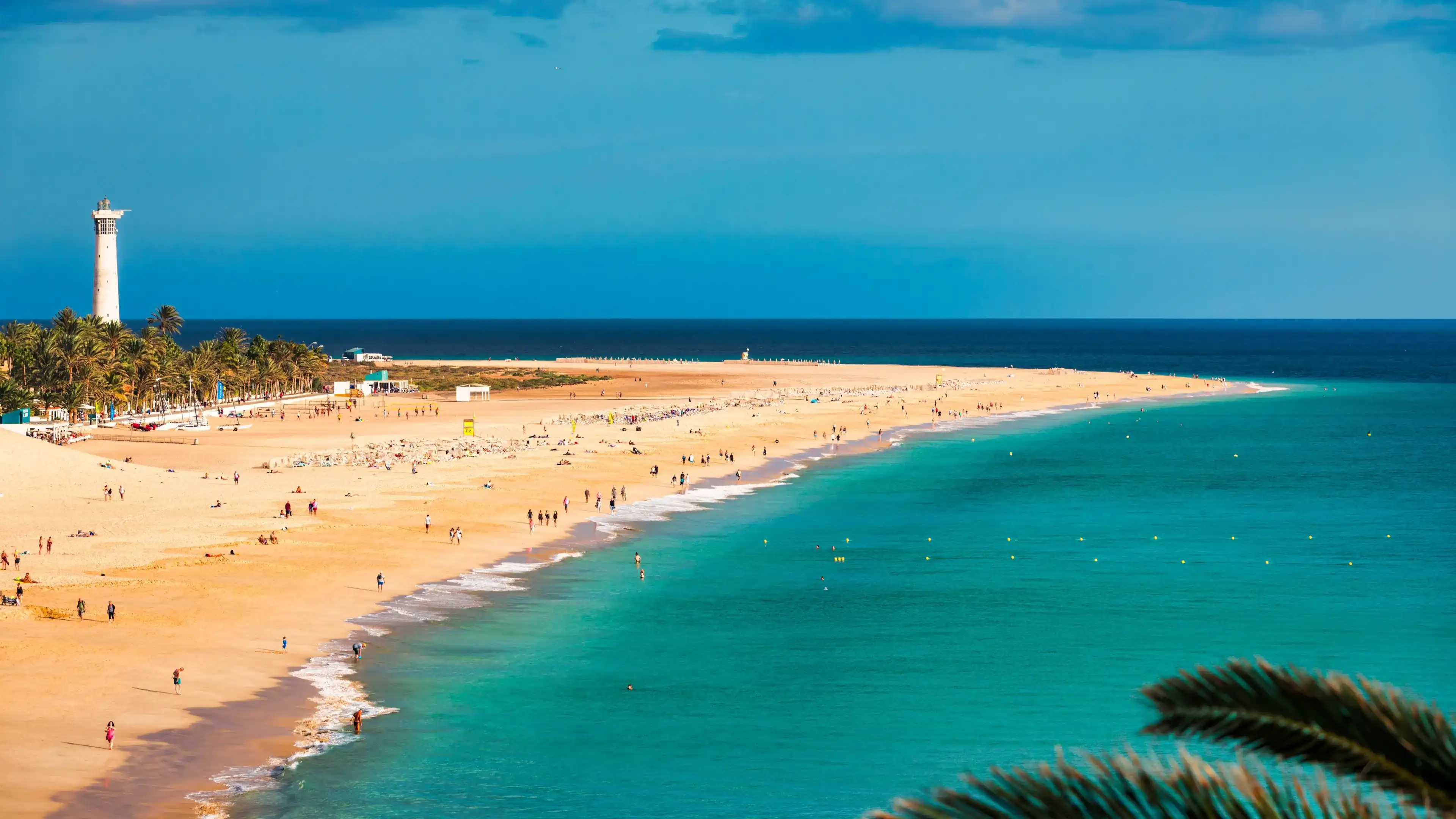 Morro Jable, Fuerteventura, Spain. Breathtaking beach Playa del Matorral in the rays of the sunset. Morro Jable and Playa del Matorral, Fuerteventura, Canary Islands, Spain, Atlantic, Europe Morro Jable, Fuerteventura, Spain. Breathtaking beach Playa del Matorral in the rays of the sunset. Morro Jable and Playa del Matorral, Fuerteventura, Canary Islands, Spain, Atlantic, Europe