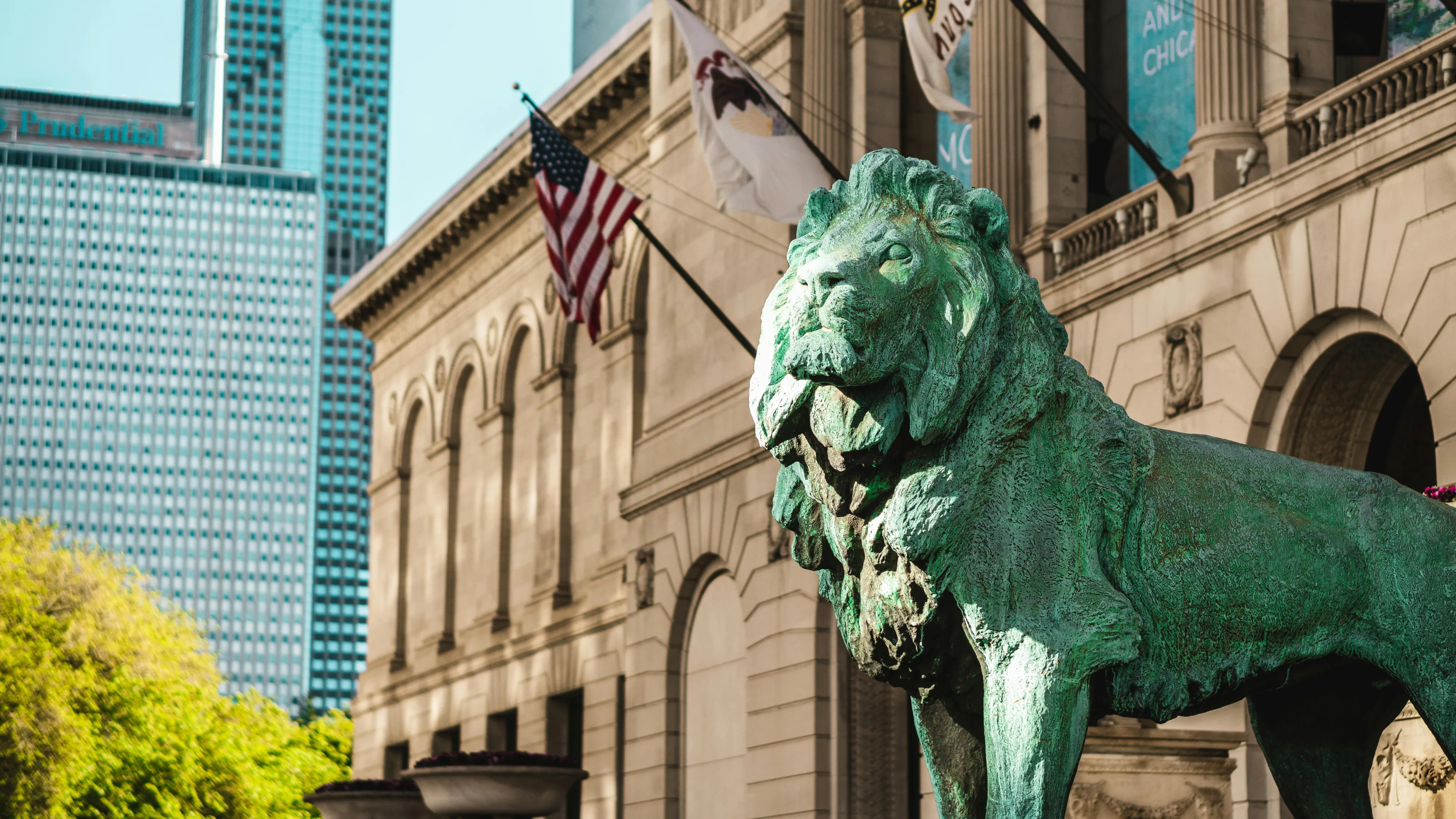 Green Lion Statue Near the Concrete Building