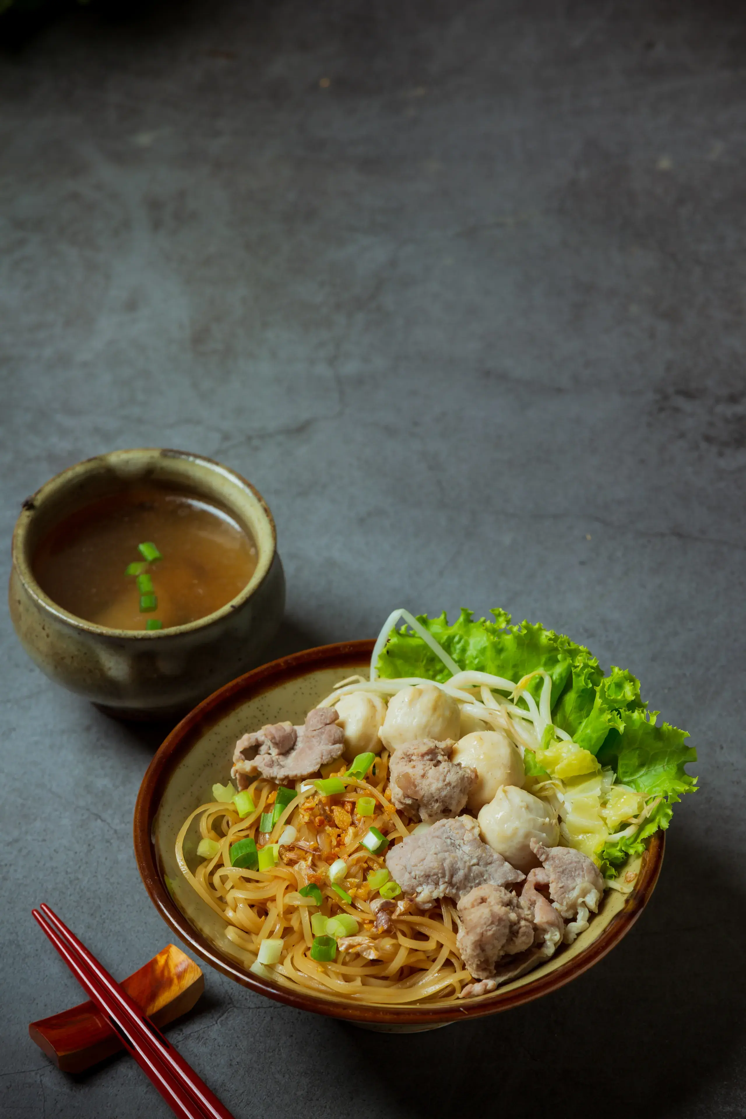 Dry thin noodles with stewed pork and pork ball. Dry thin noodles with stewed pork and pork ball.